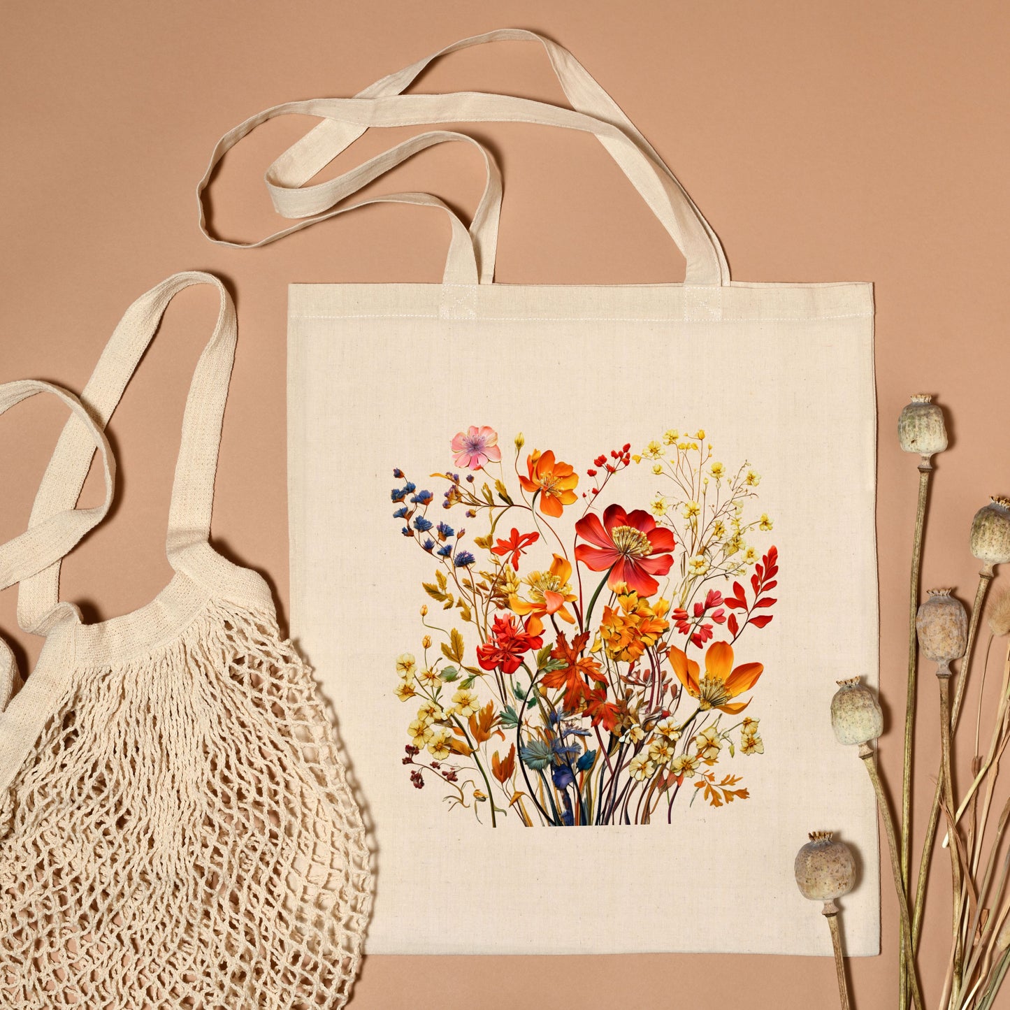 Flat Lay of cotton canvas tote bag with a printed bouquet of autumn wildflowers in warm fall tones.