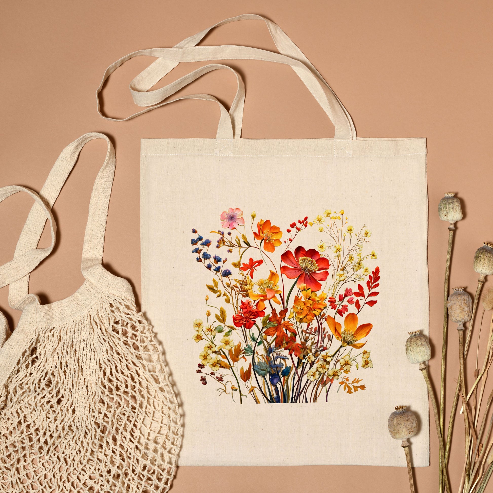 Flat Lay of cotton canvas tote bag with a printed bouquet of autumn wildflowers in warm fall tones.