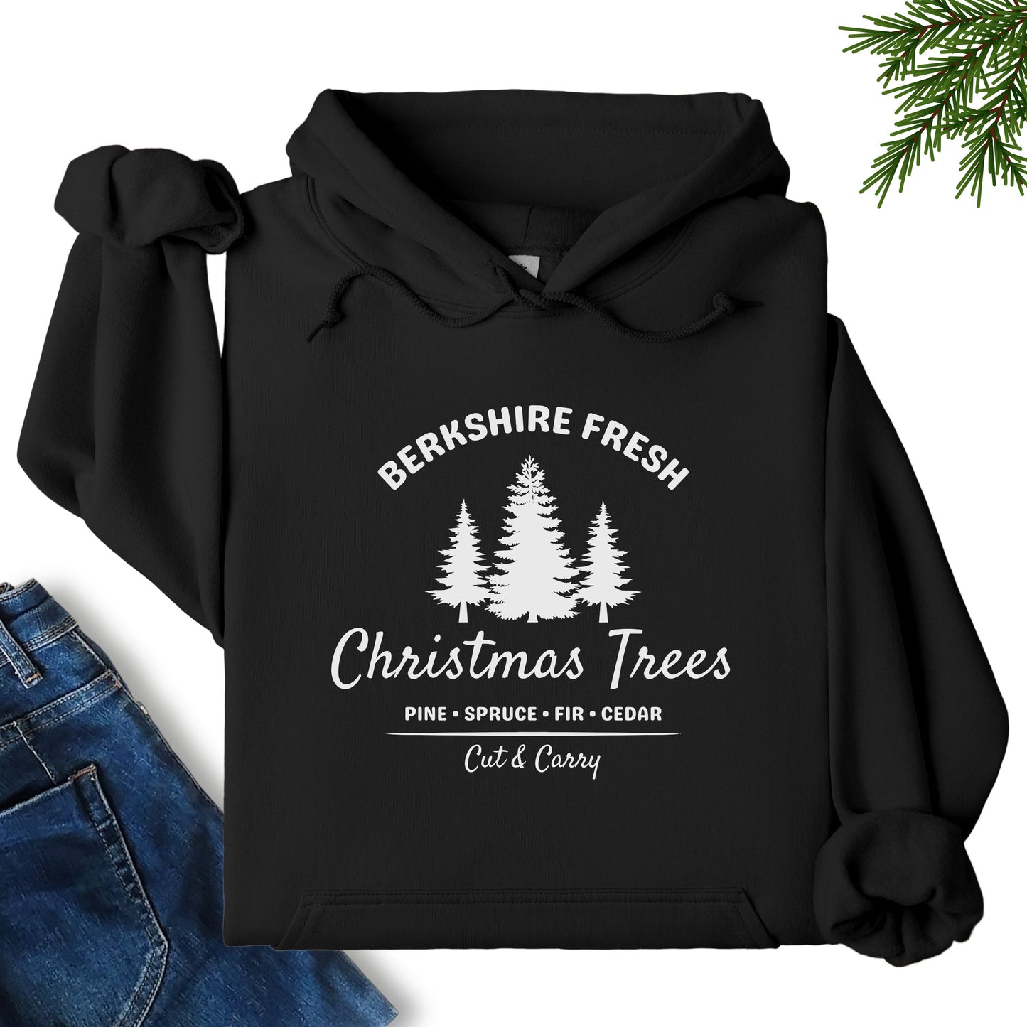 Berkshire Fresh Christmas Trees hoodie in black laid flat showing festive tree farm graphic on the front