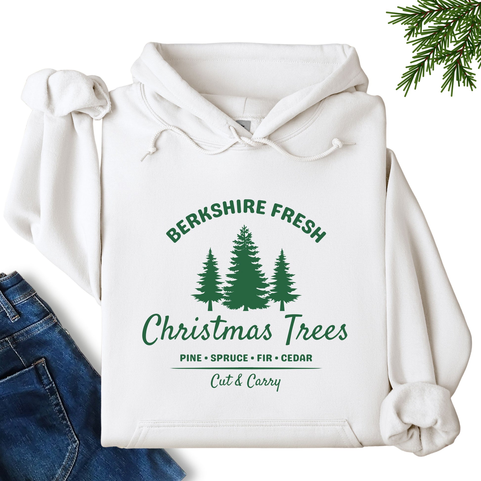 Berkshire Fresh Christmas Trees hoodie in white laid flat showing festive tree farm graphic on the front