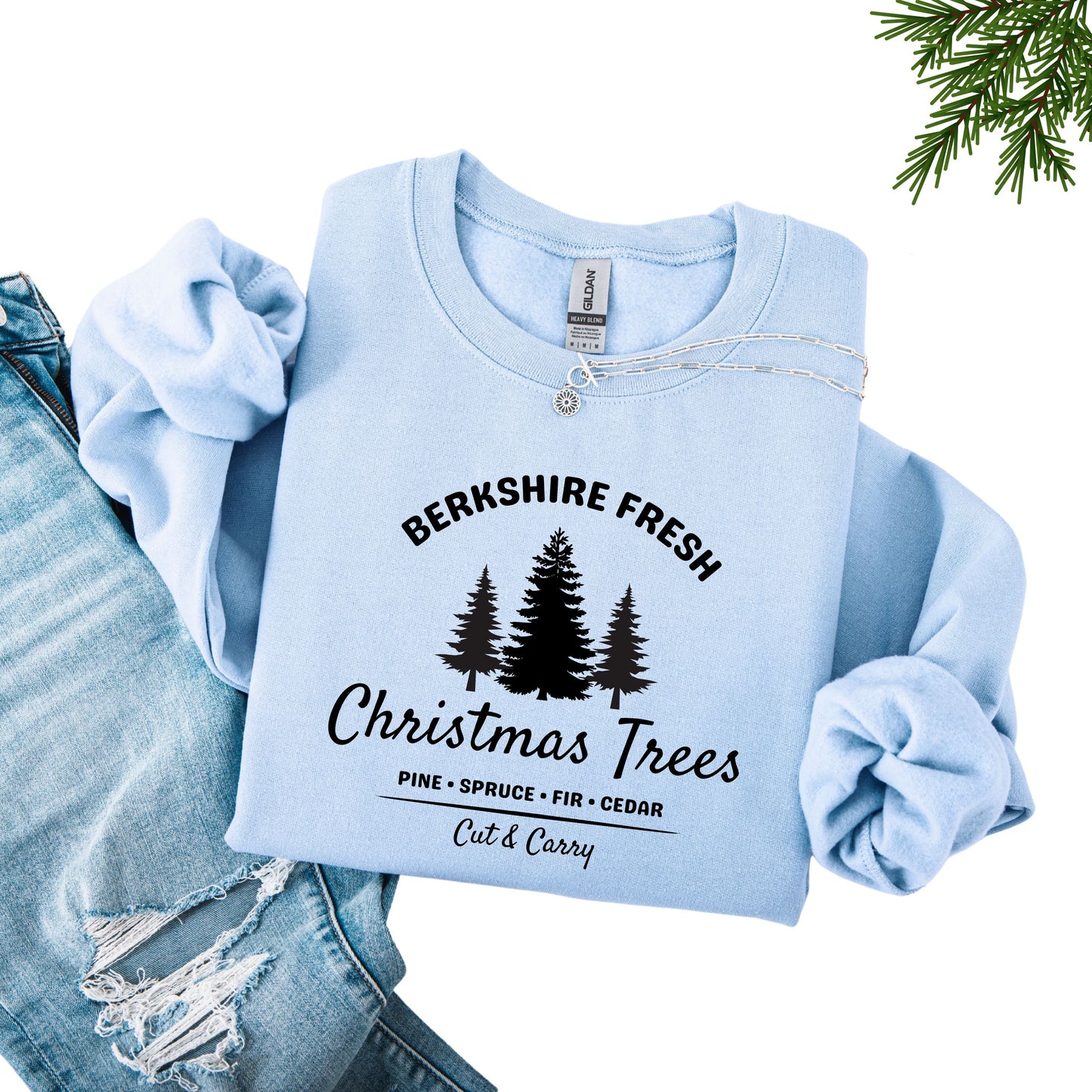 Light blue sweatshirt with 'Berkshire Fresh Christmas Trees' black text and tree graphic.