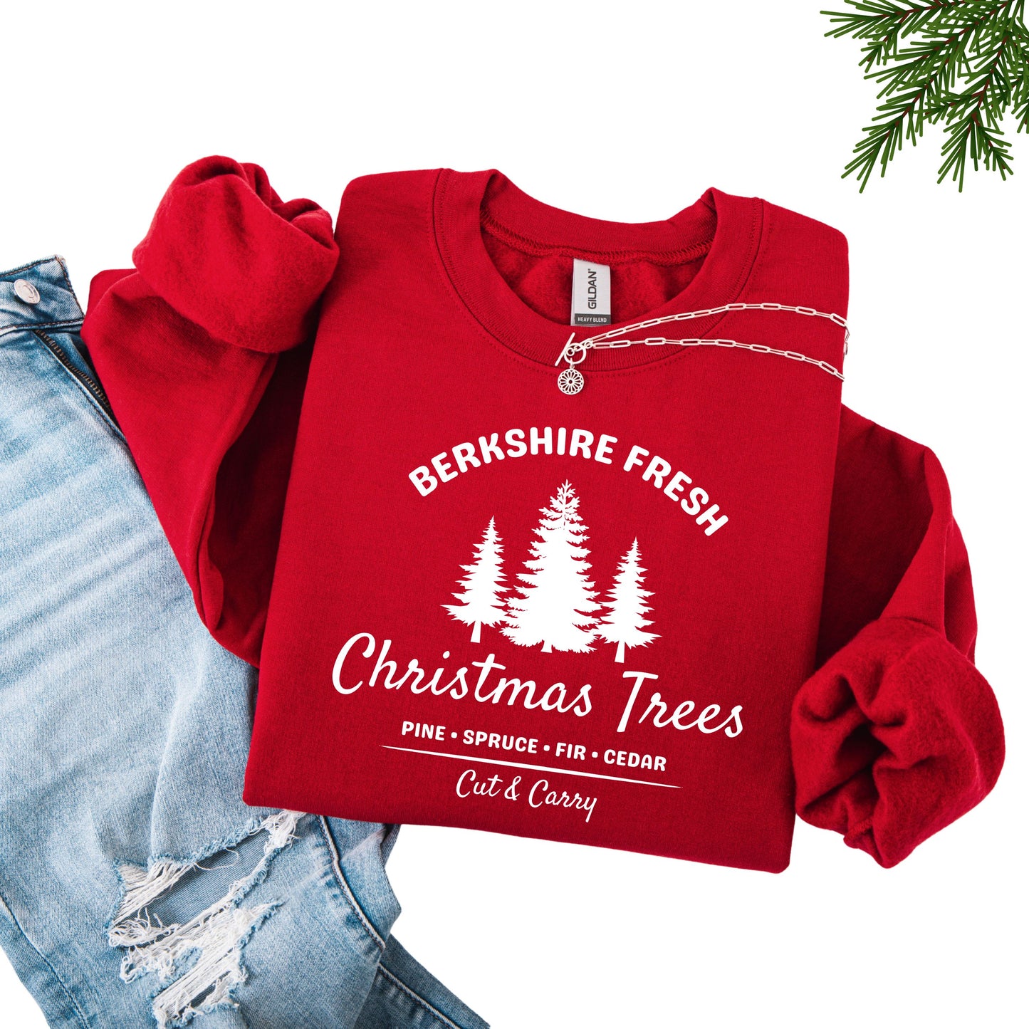 Red sweatshirt with 'Berkshire Fresh Christmas Trees' white text and tree graphic.
