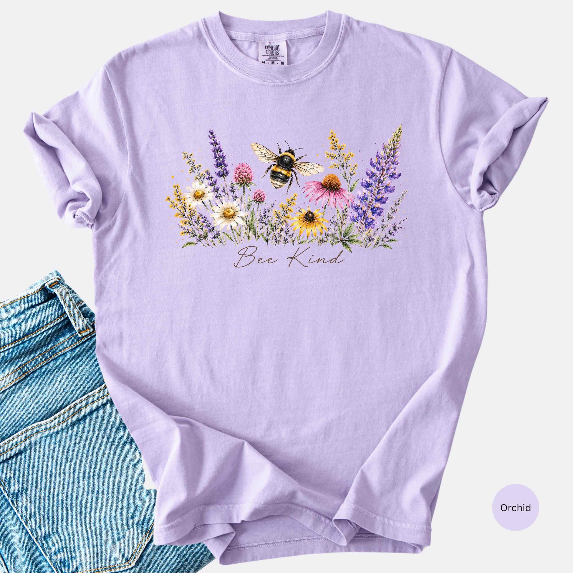 Bee Kind Comfort Colors t-shirt with watercolor bee and wildflowers in the color orchard.