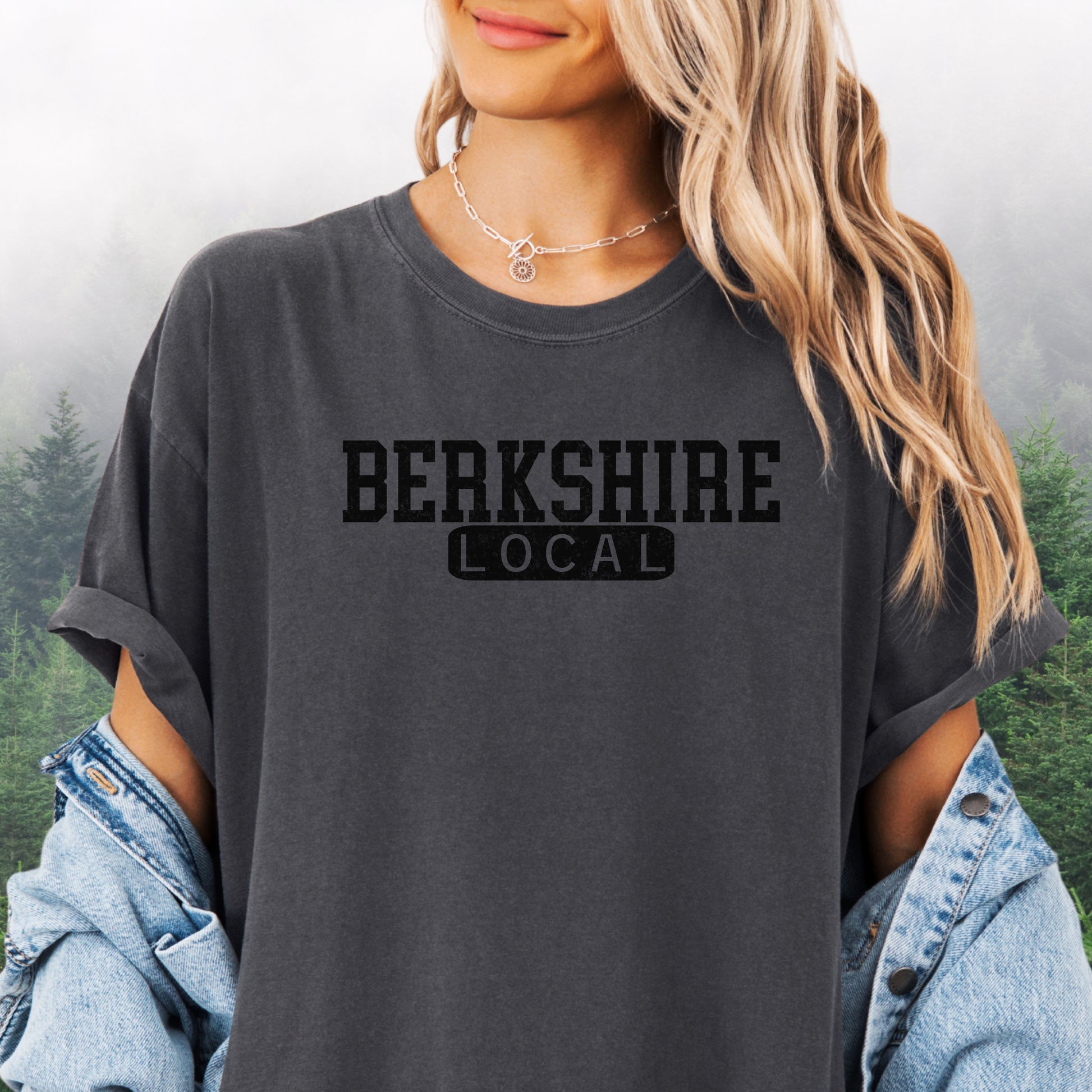 Person wearing Berkshire Local vintage distressed graphic on a pepper Comfort Colors t shirt