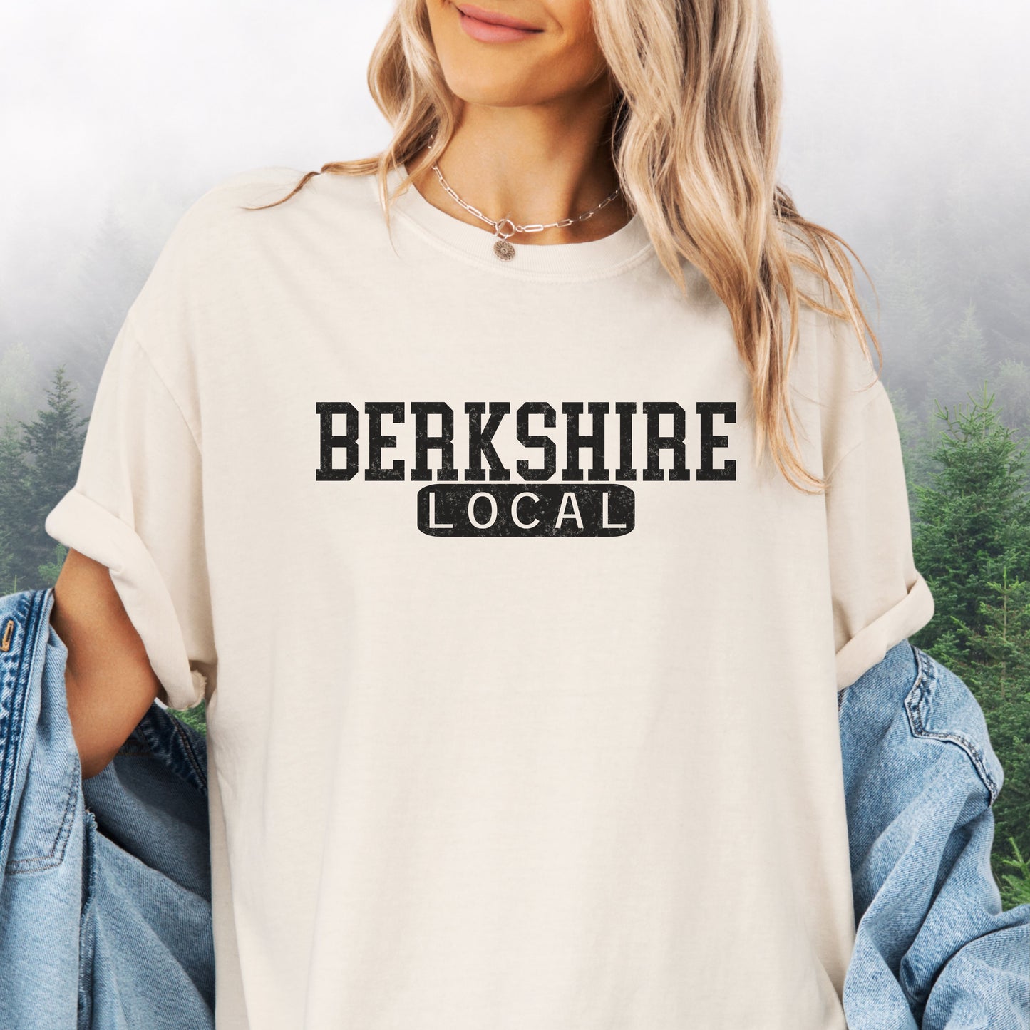 Person wearing Berkshire Local vintage distressed graphic on an ivory Comfort Colors t shirt