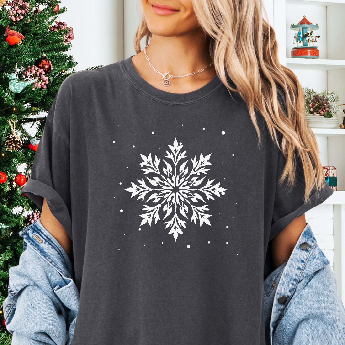 Person wearing a Comfort Colors tshirt with snowflake design in the color pepper