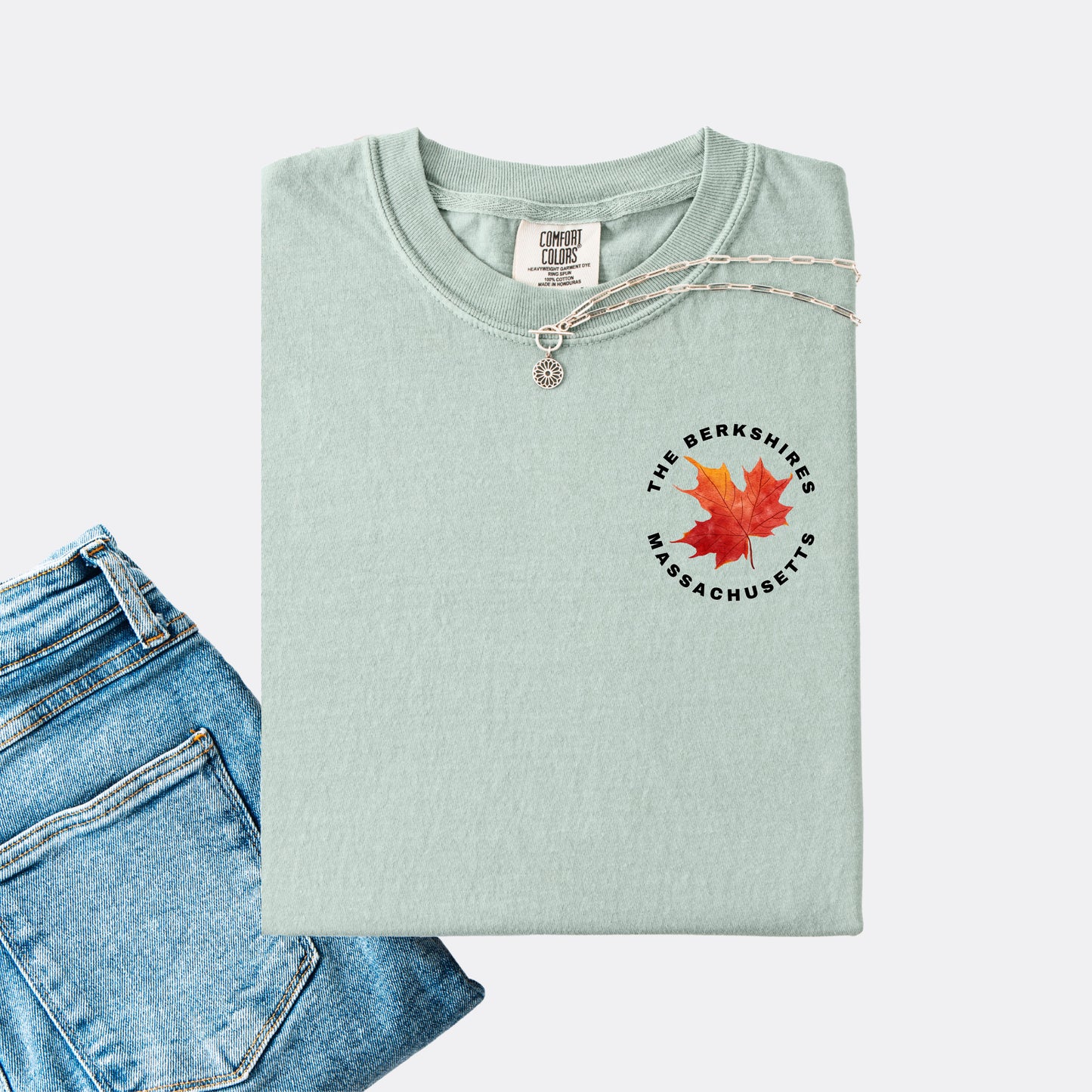 Comfort Colors T-shirt in the color bay. The front chest design features a red maple leaf with text reading ‘The Berkshires Massachusetts.’”