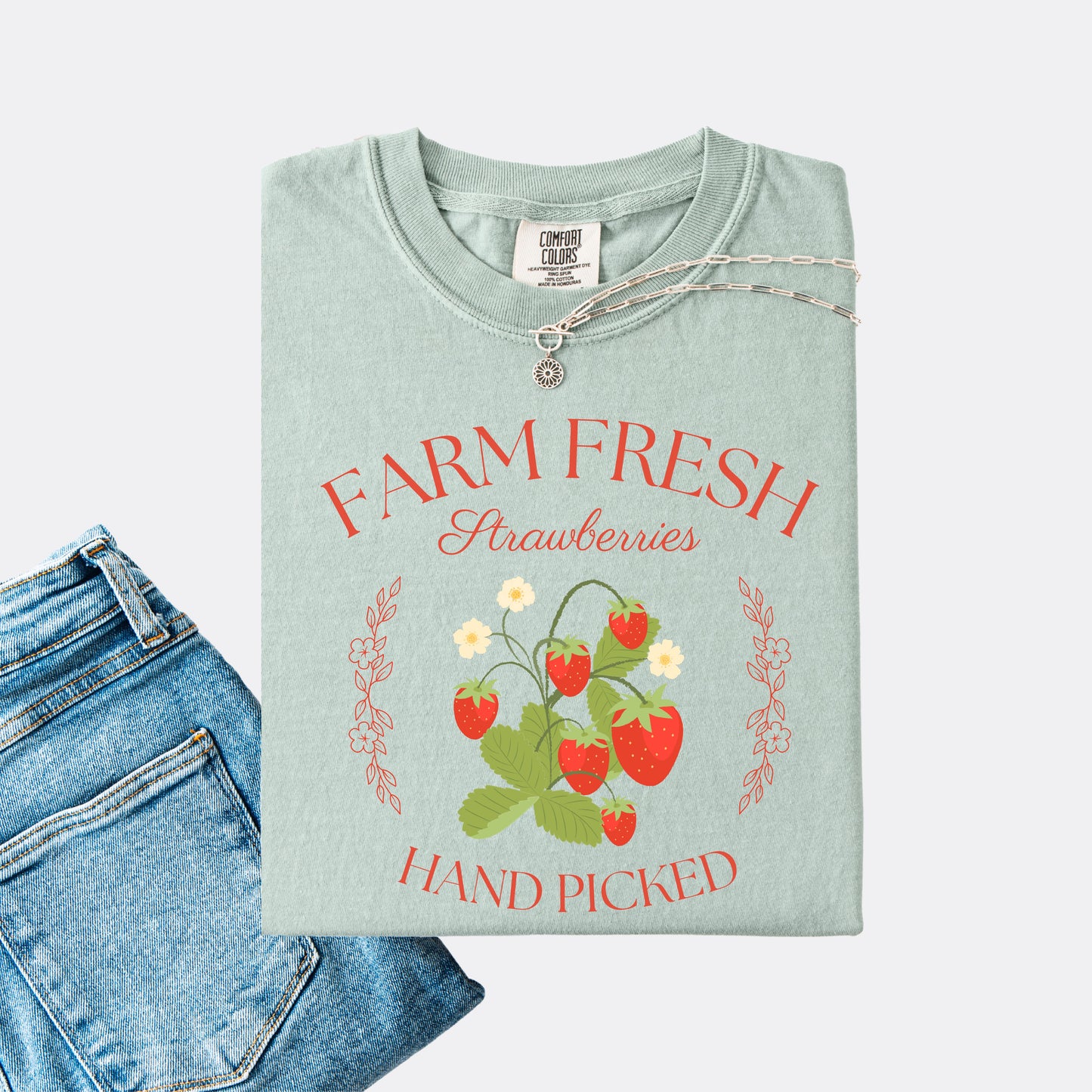 Comfort Colors shirt in the color bay with a vintage style farm fresh strawberries hand picked design.