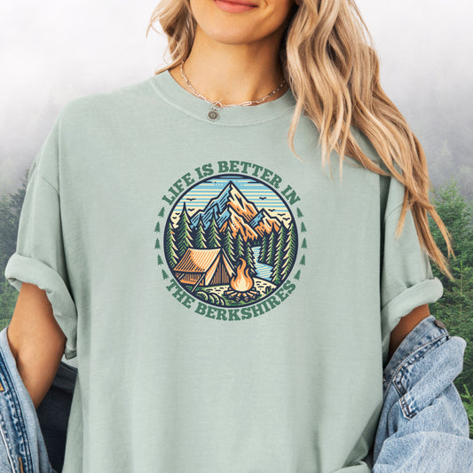 Person wearing bay colored Comfort Colors shirt with mountain design and the text: Life Is Better In The Berkshires