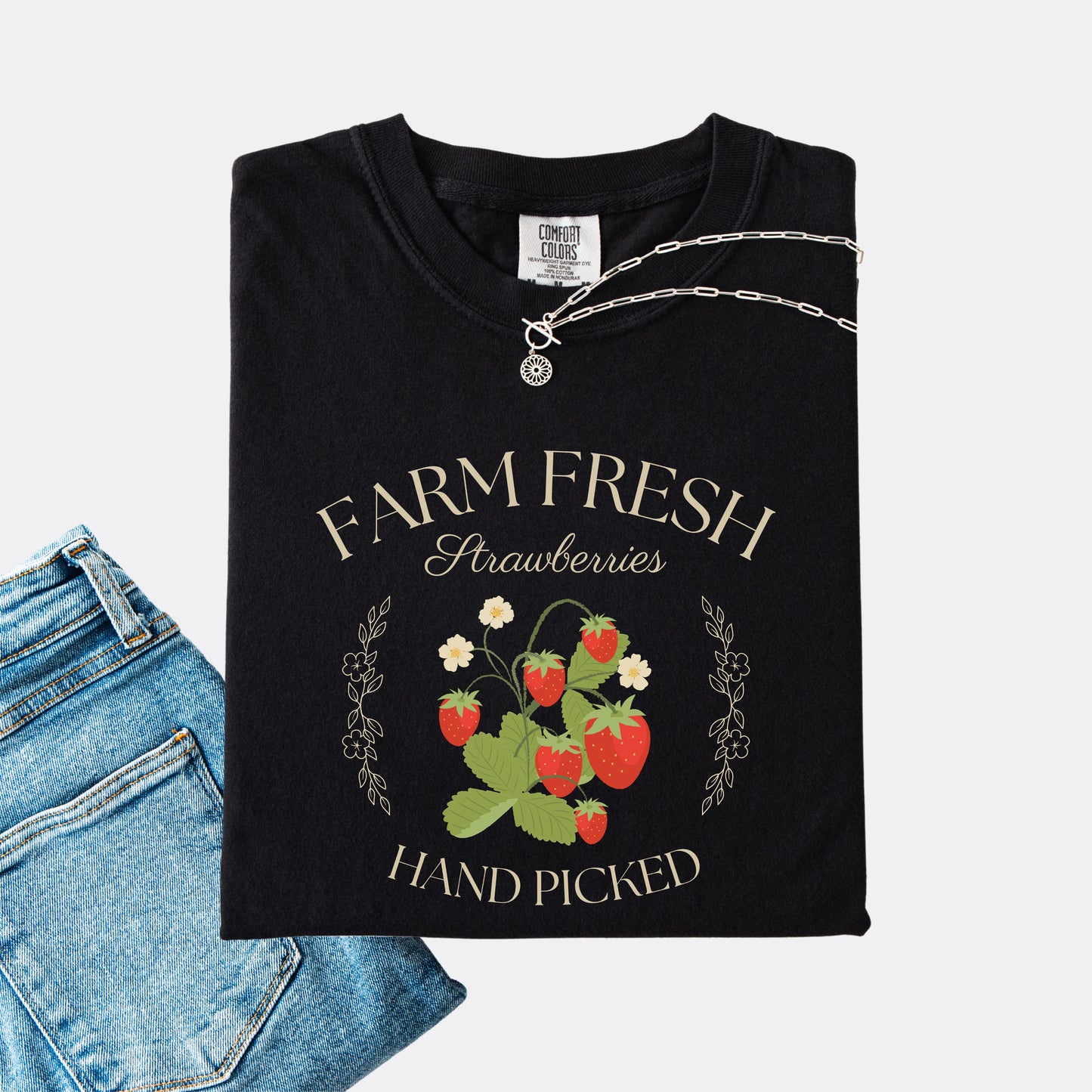 Comfort Colors shirt in black with a vintage style farm fresh strawberries hand picked design.