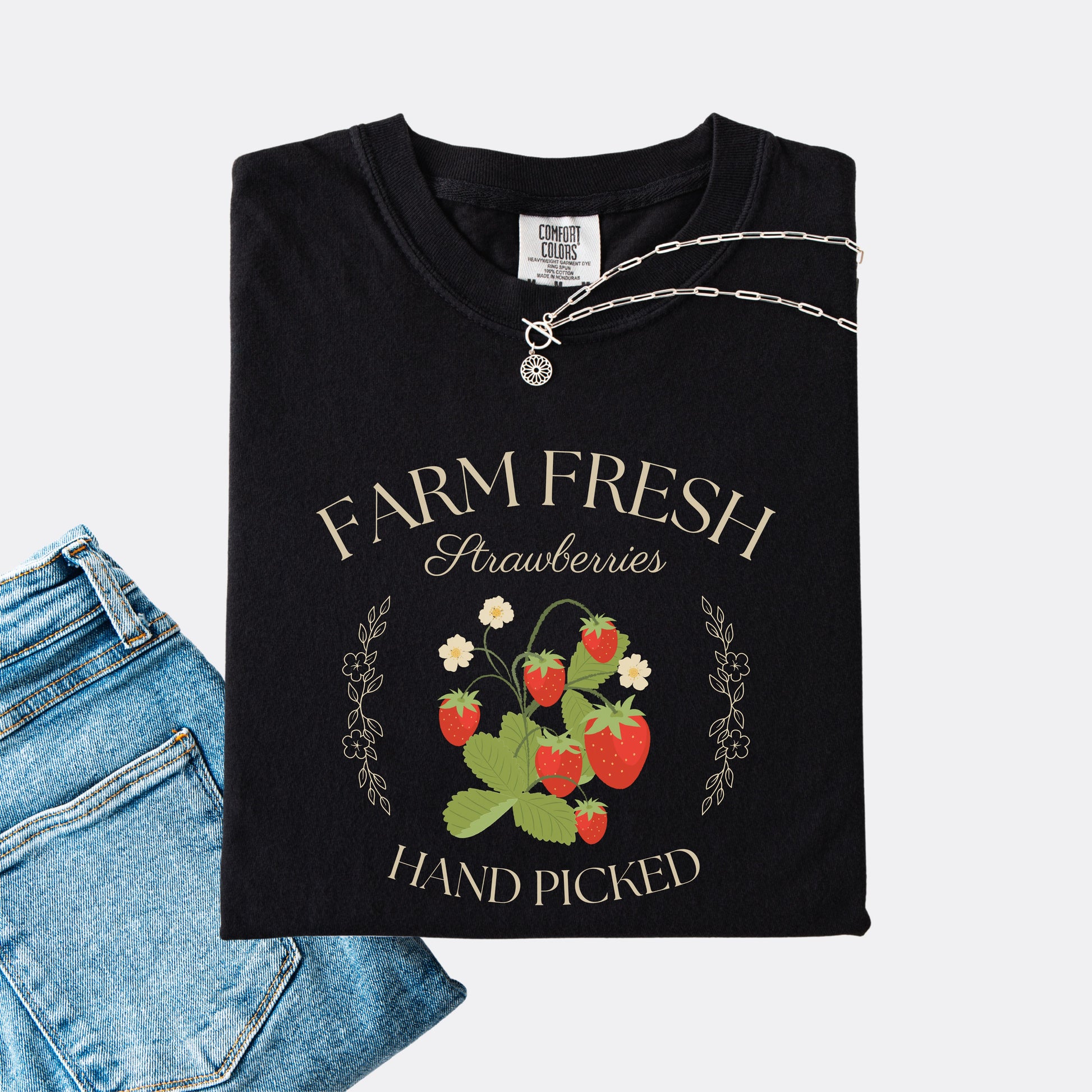 Comfort Colors shirt in black with a vintage style farm fresh strawberries hand picked design.