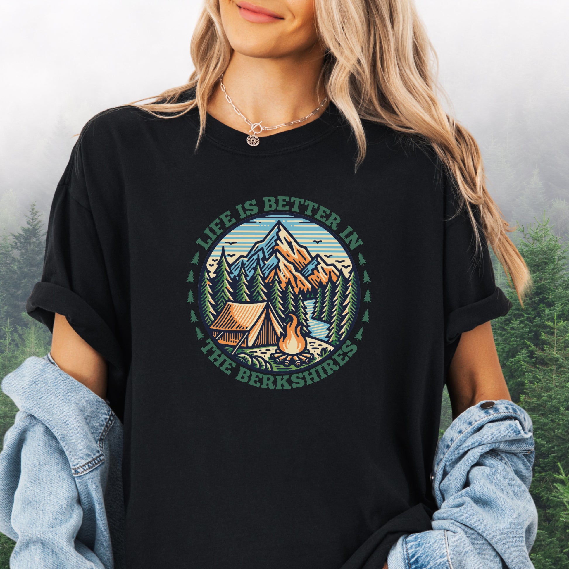 Person wearing black Comfort Colors shirt with mountain design and the text: Life Is Better In The Berkshires