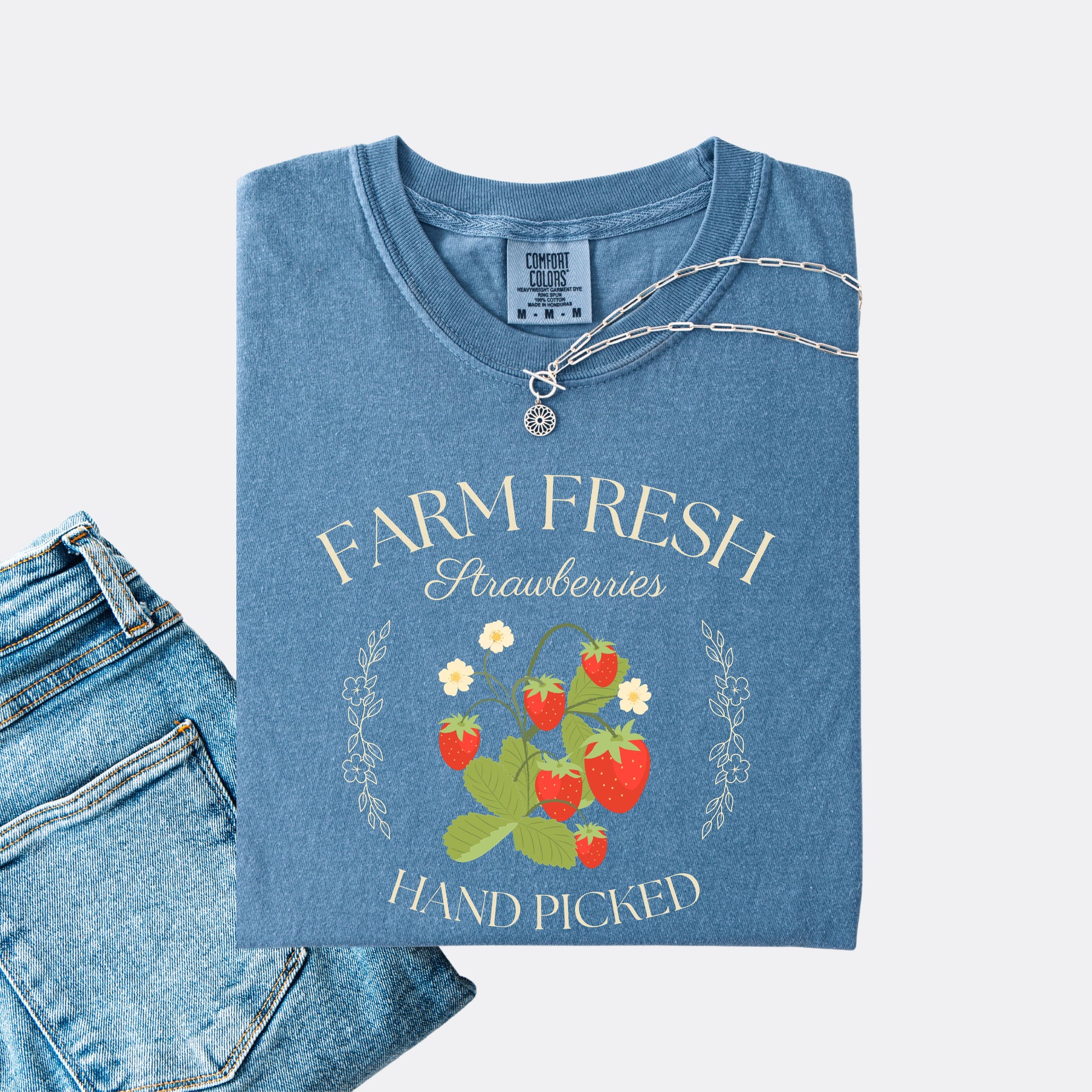 Comfort Colors shirt in blue jean with a vintage style farm fresh strawberries hand picked design.