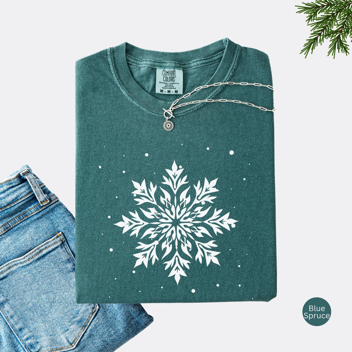 Comfort Colors tshirt with snowflake design in the color blue spruce