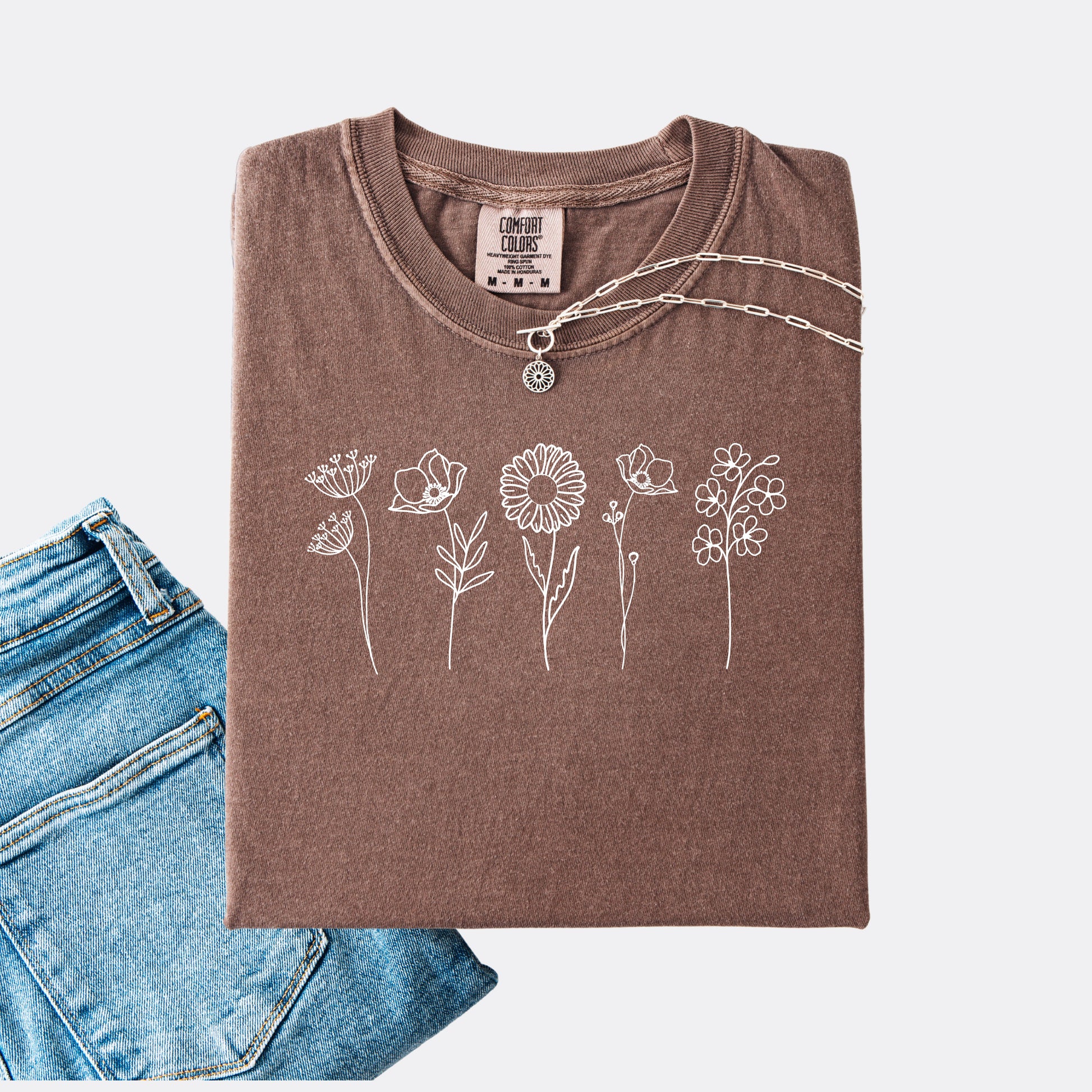 Comfort Colors expresso T-shirt featuring a minimalist white line art design of six different wildflowers.