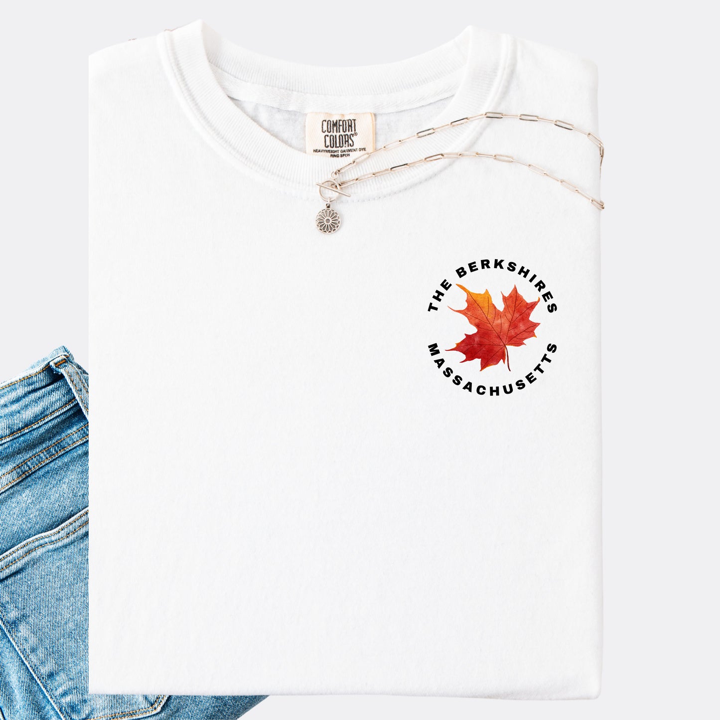 Comfort Colors T-shirt in the color white. The front chest design features a red maple leaf with text reading ‘The Berkshires Massachusetts.’”