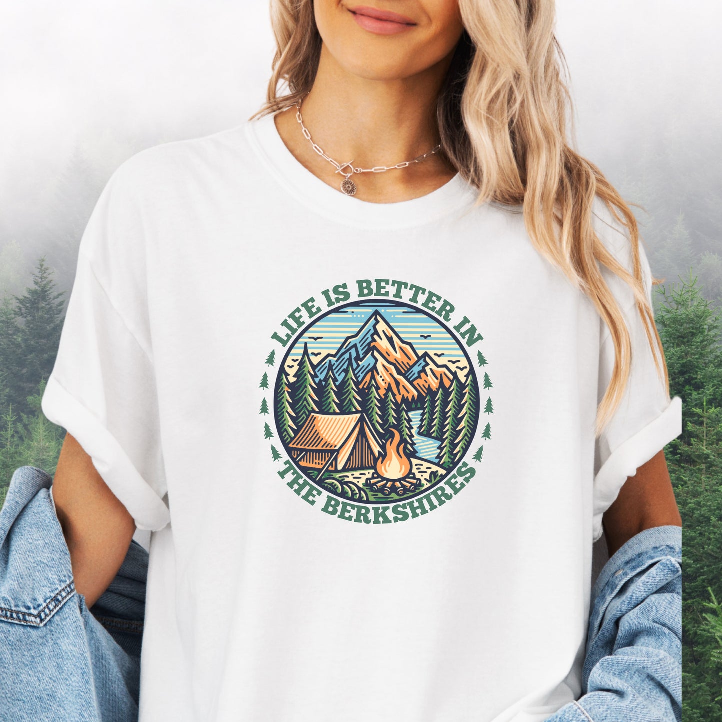 Person wearing white Comfort Colors shirt with mountain design and the text: Life Is Better In The Berkshires