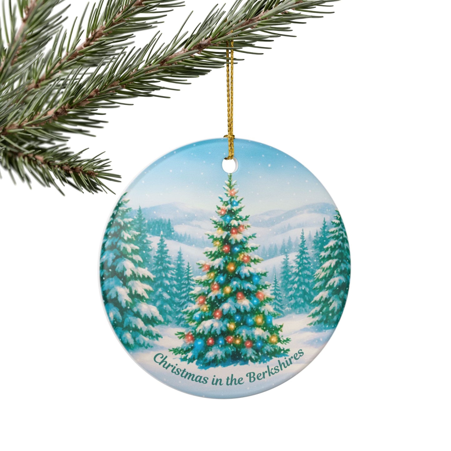 Christmas in the Berkshires ceramic ornament hanging on a Christmas tree branch