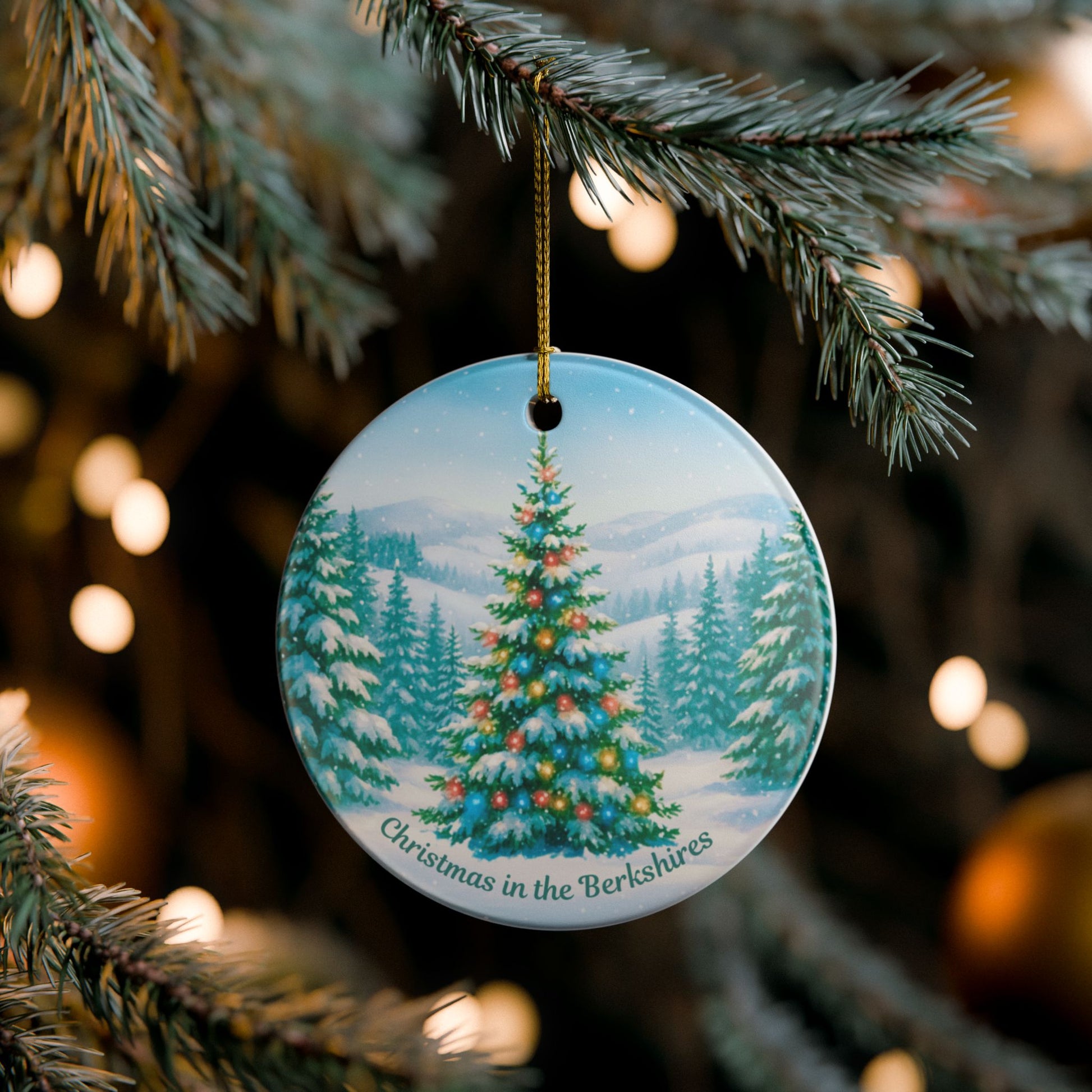 Christmas in the Berkshires ceramic ornament hanging on a Christmas tree