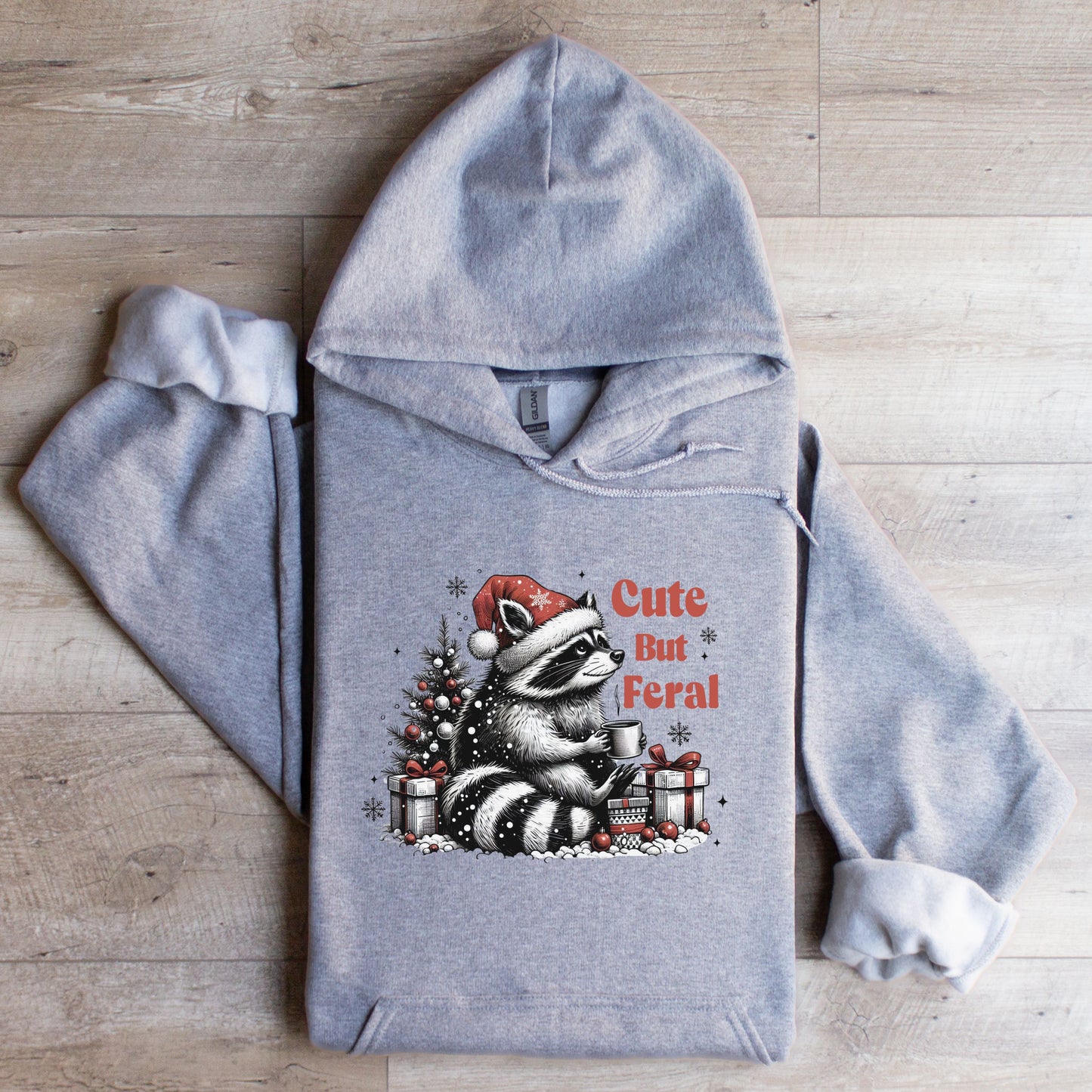 Cute But Feral Hooded Sweatshirt with racoon flat lay sport grey color