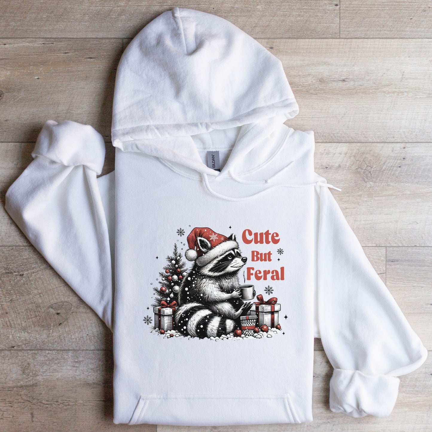 Cute But Feral Hooded Sweatshirt with racoon flat lay white color