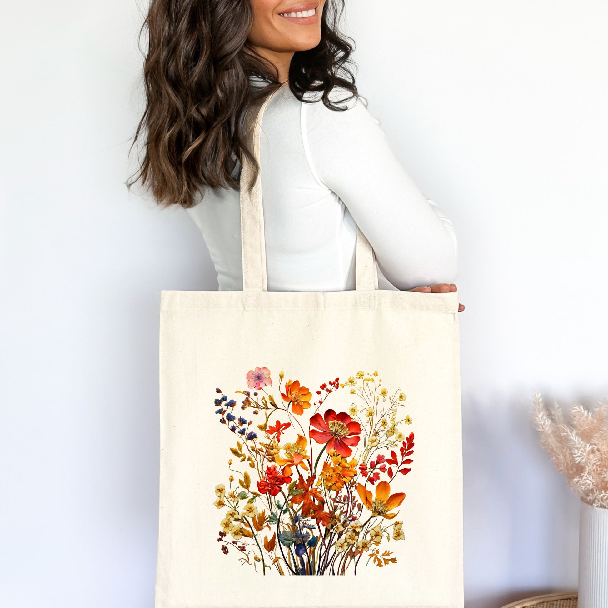 Fall Floral Canvas Tote Bag displayed on shoulder