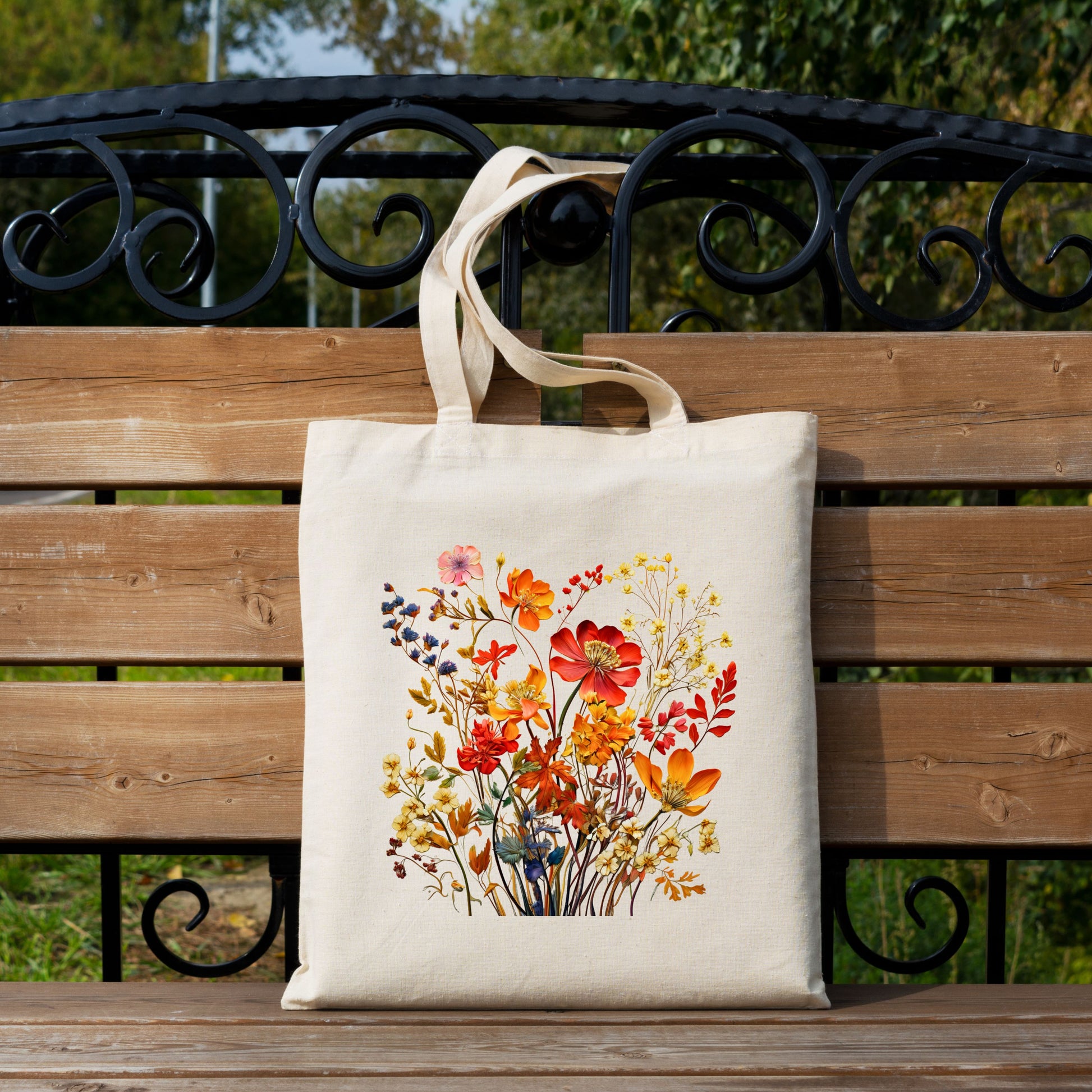 Fall Floral Canvas Tote Bag displayed on bench