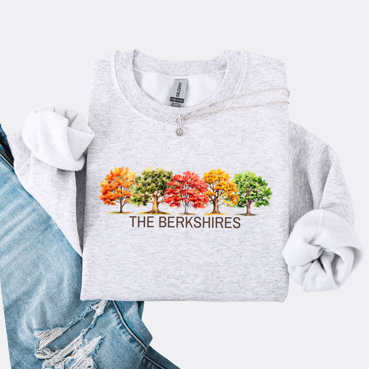 Ash colored crewneck sweatshirt featuring colorful watercolor trees above the words The Berkshires.