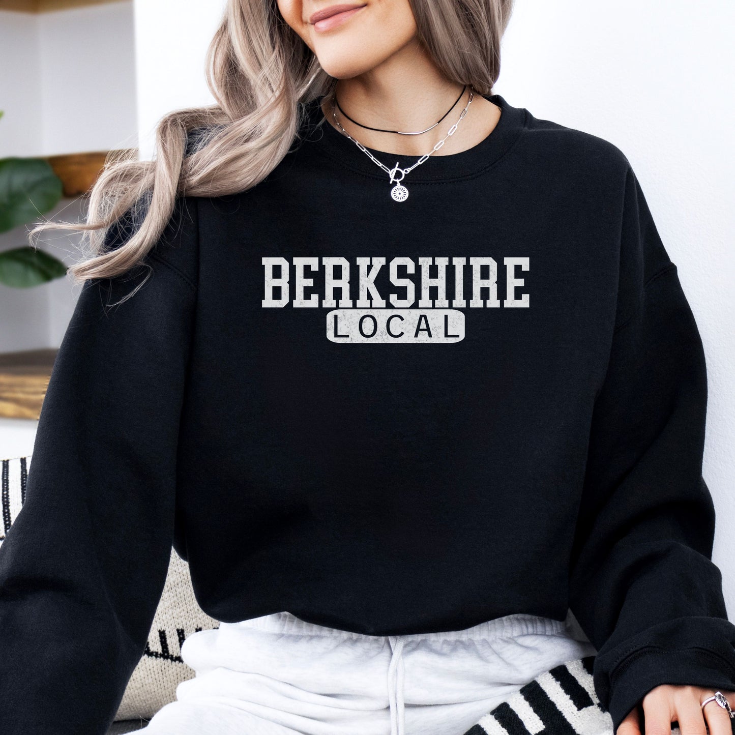 Person wearing Berkshire Local vintage distressed Massachusetts crewneck sweatshirt in the color black