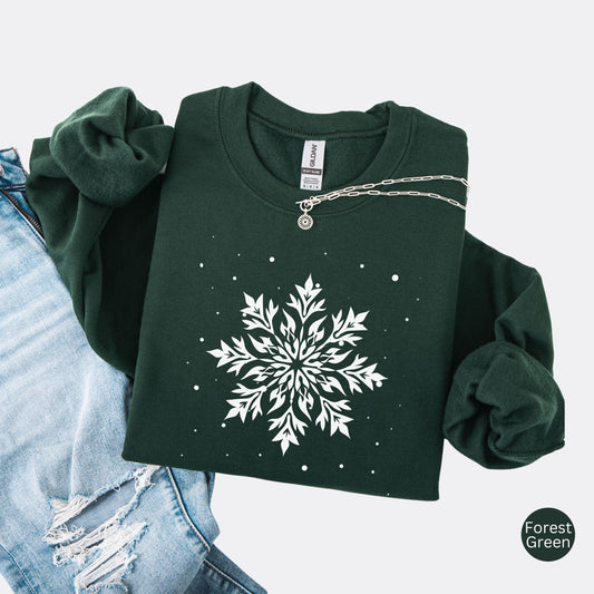 Snowflake design with falling snow on cozy unisex winter sweatshirt in the color forest green