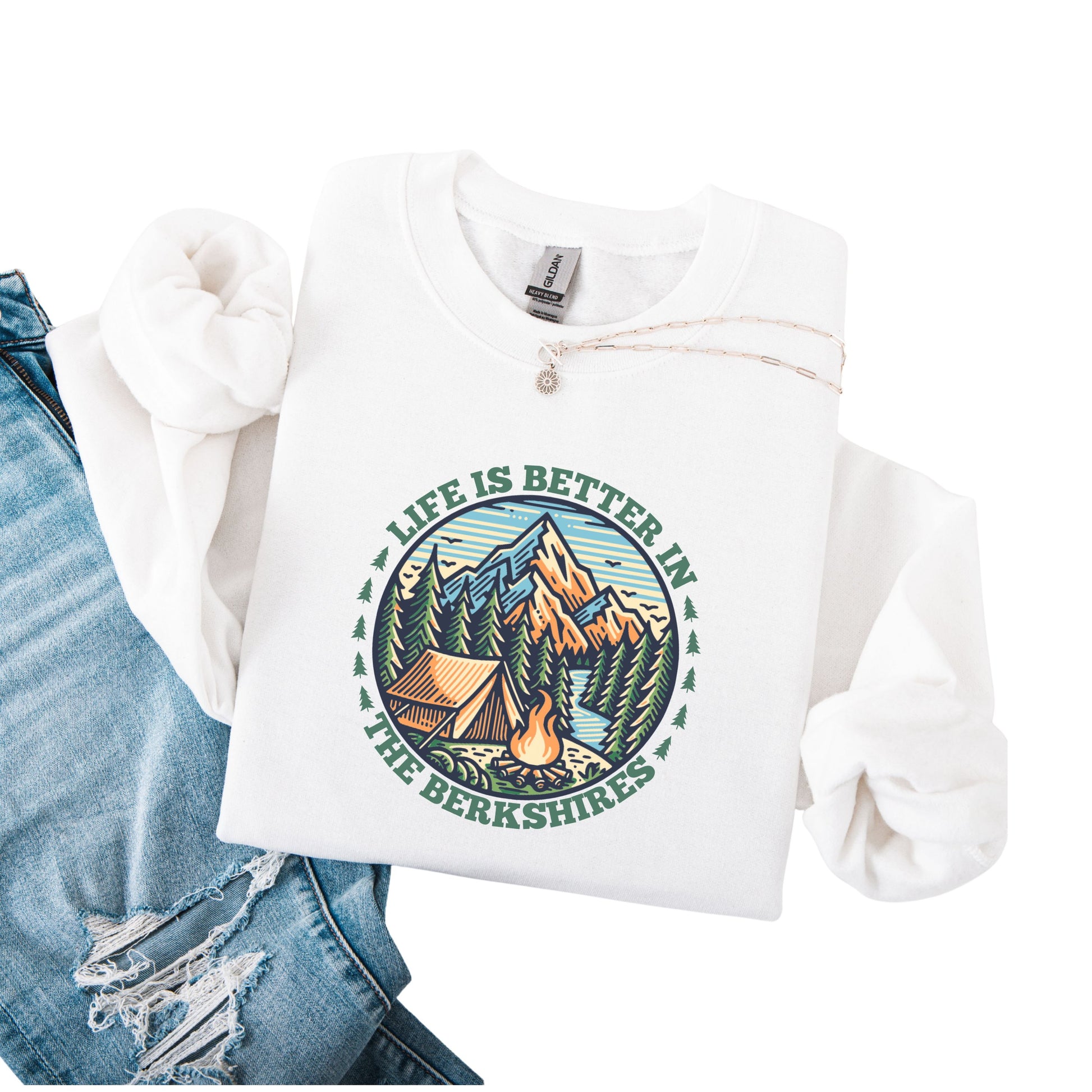White sweatshirt with mountain scene pine trees tent and campfire graphic with the text Life Is Better In The Berkshires