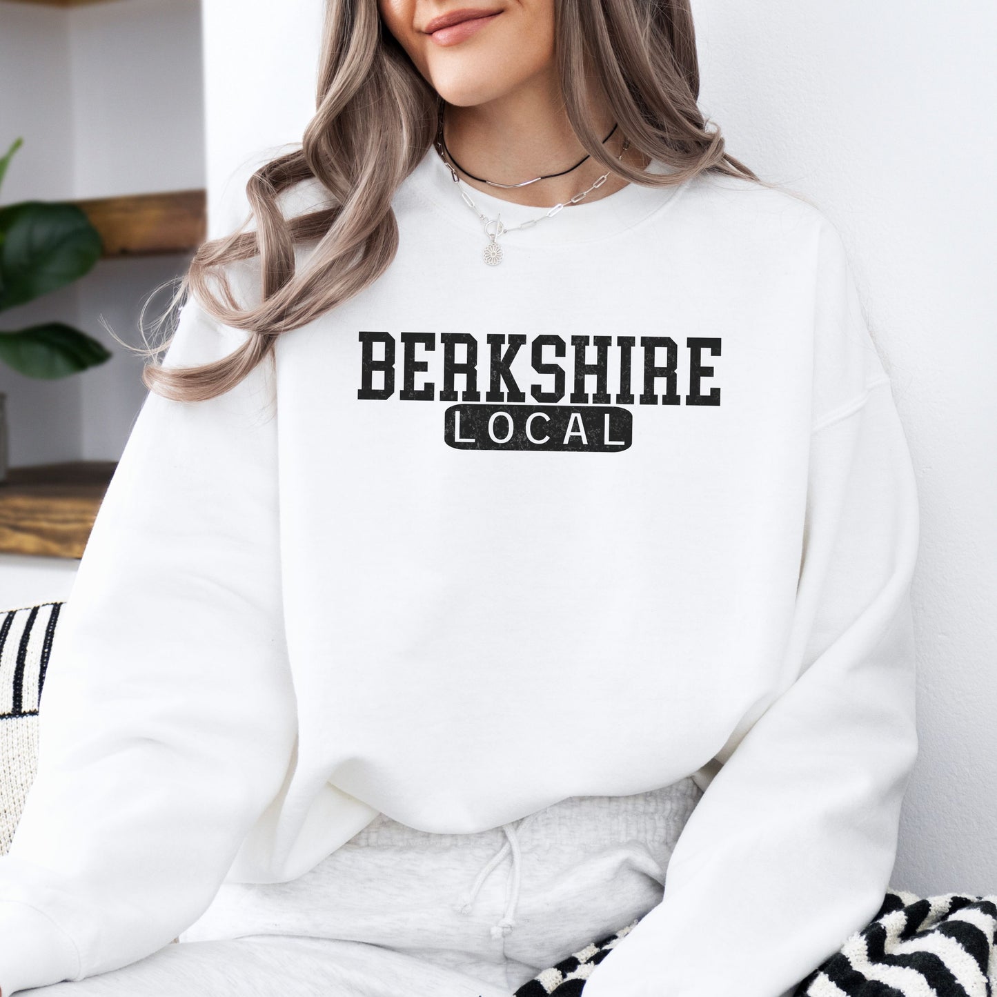 Person wearing Berkshire Local vintage distressed Massachusetts crewneck sweatshirt in the color white