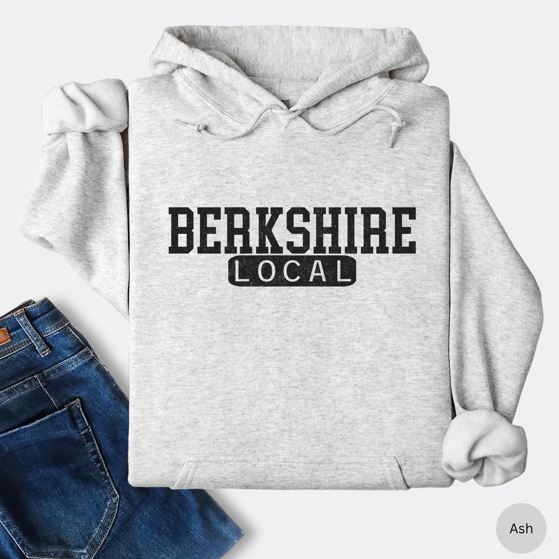 Person wearing Berkshire Local vintage distressed Massachusetts hoodie with collegiate lettering in the color ash