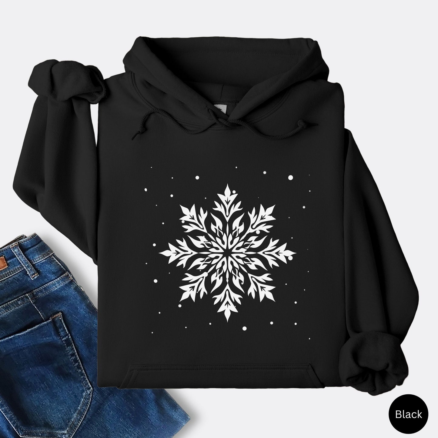 Snowflake design with falling snow on cozy unisex hoodie in the color black