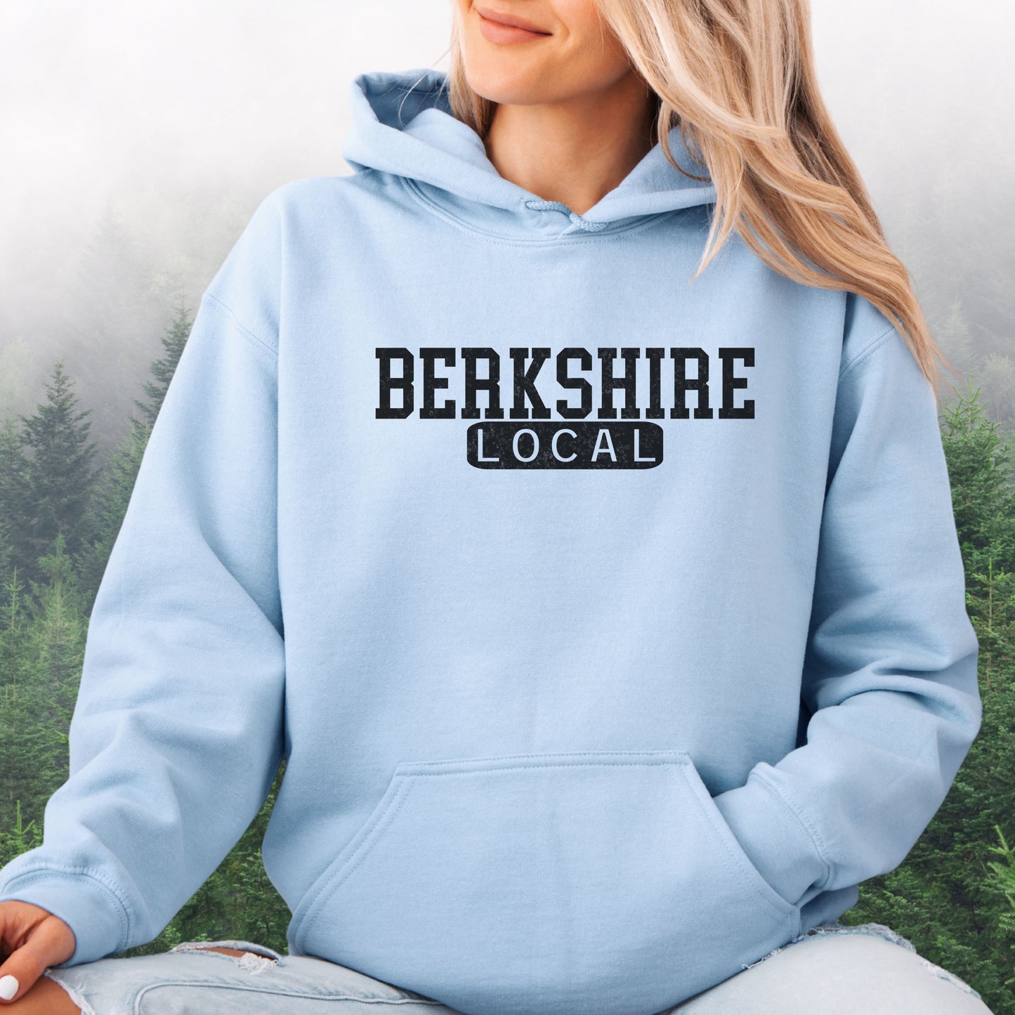 Person wearing Berkshire Local vintage distressed Massachusetts hoodie with collegiate lettering, light blue