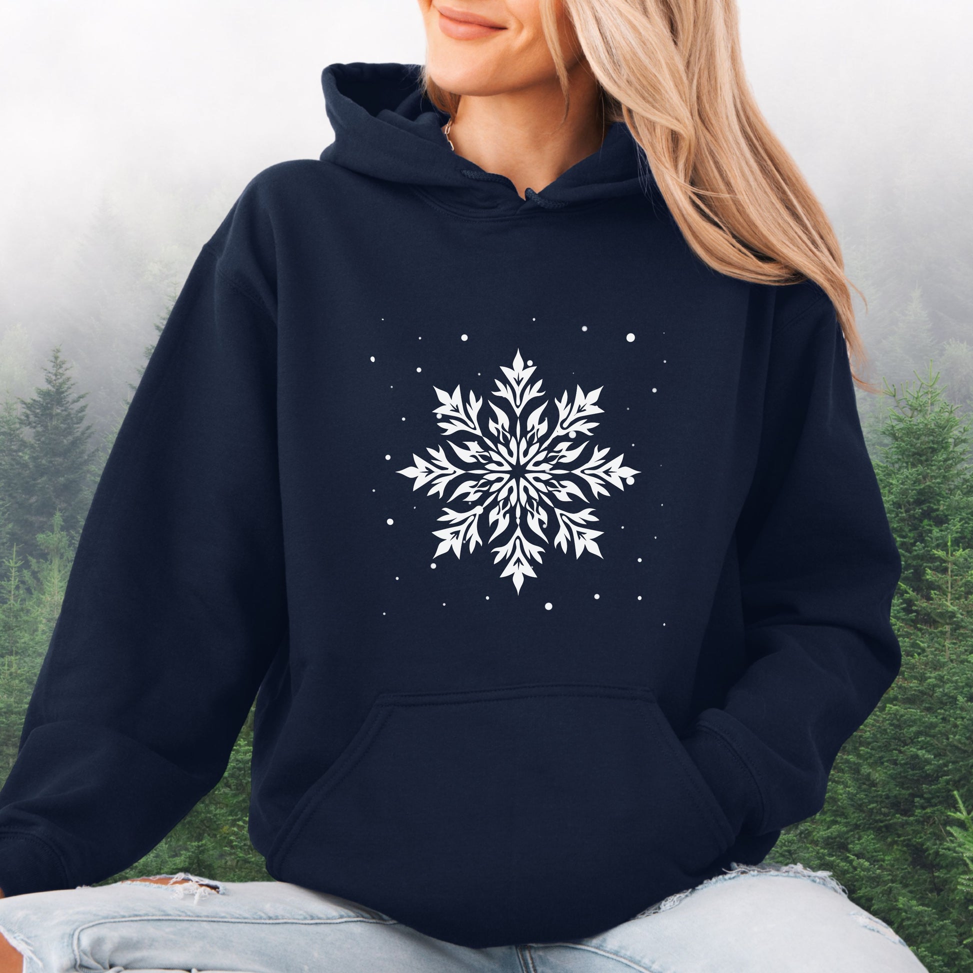 Person wearing snowflake design with falling snow on cozy unisex hoodie in the color navy