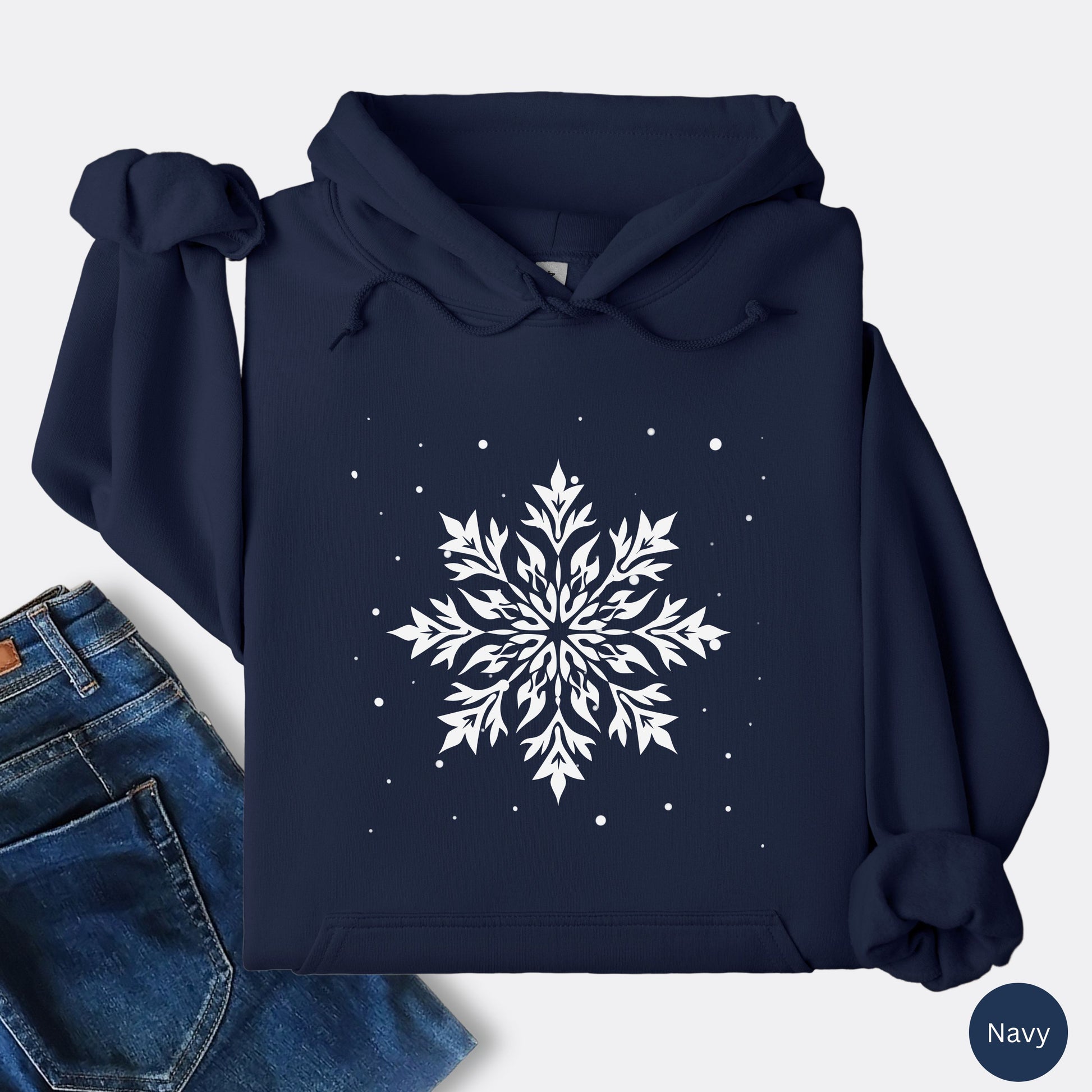 Snowflake design with falling snow on cozy unisex hoodie in the color navy
