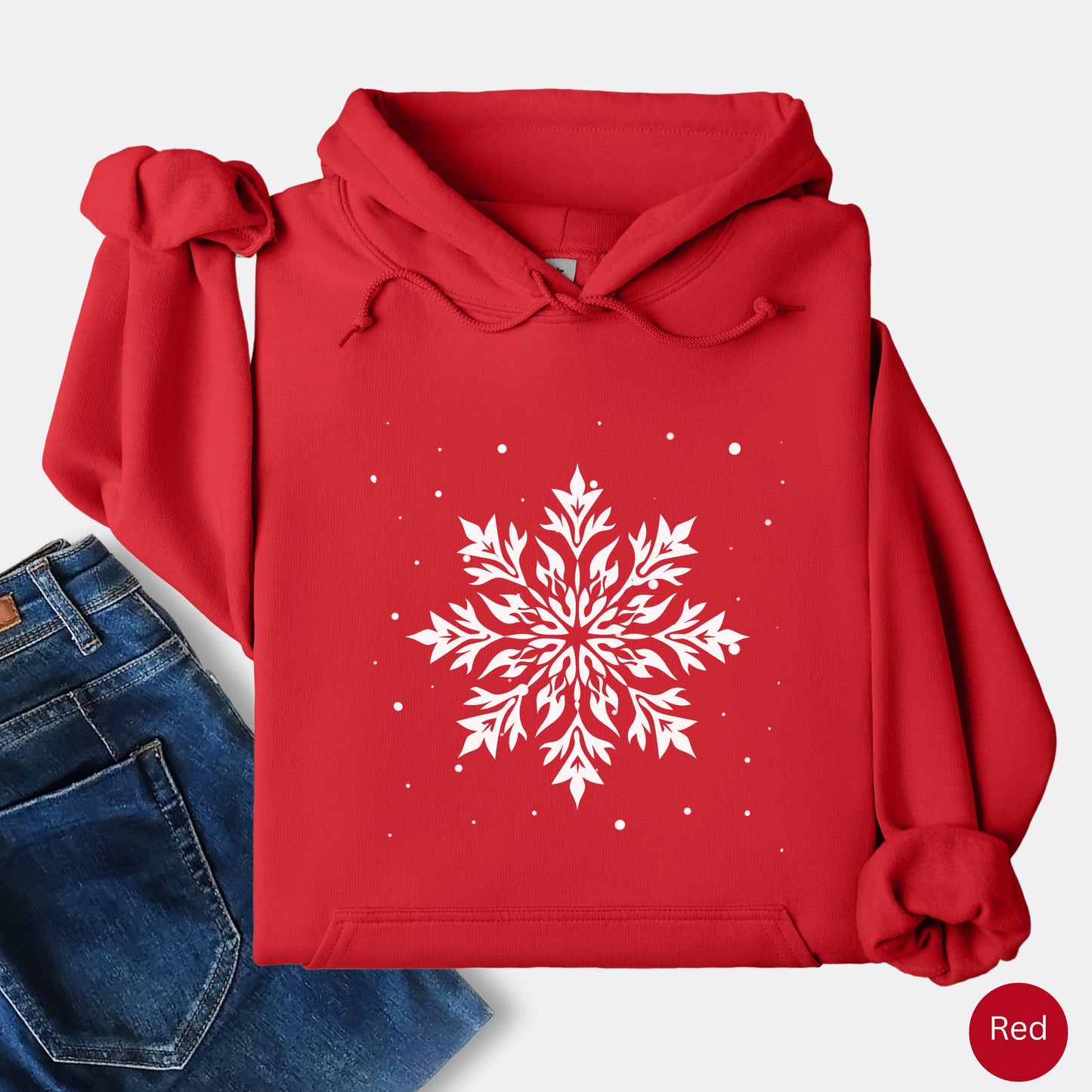 Snowflake design with falling snow on cozy unisex hoodie in the color ed
