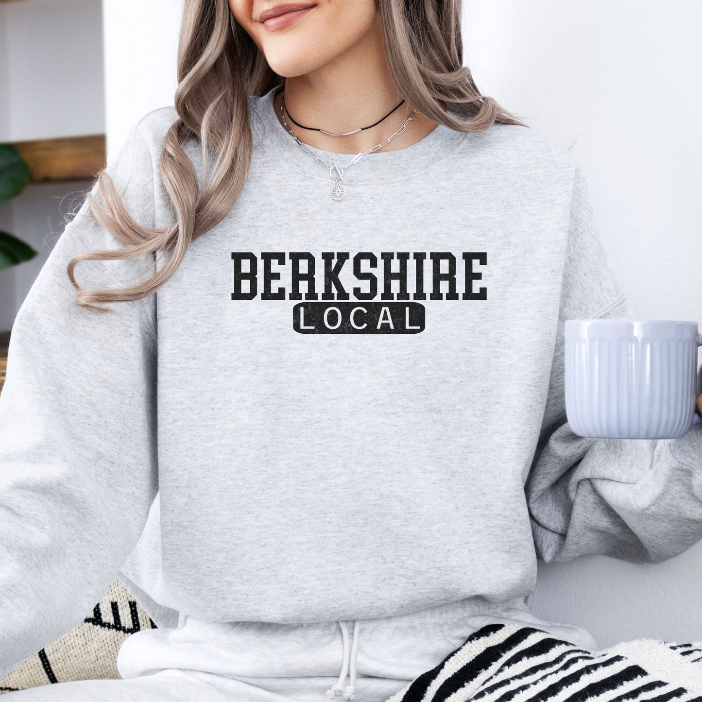 Person wearing Berkshire Local vintage distressed Massachusetts crewneck sweatshirt in the color ash