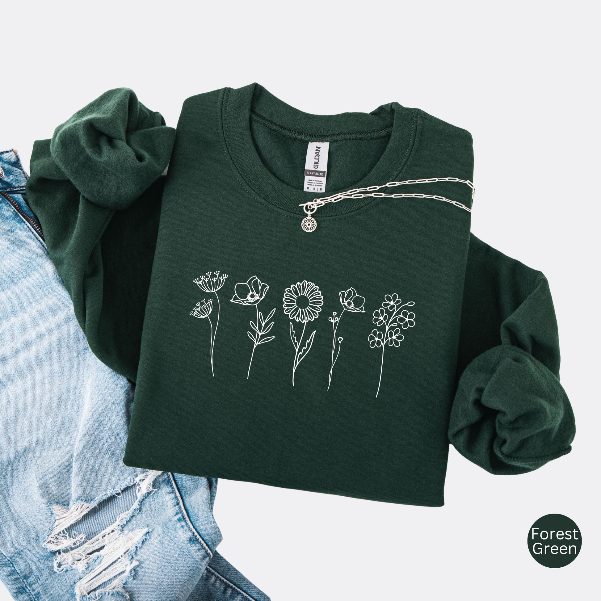 Wildflowers Crewneck Sweatshirt in the color forest green with white minimalist flowers