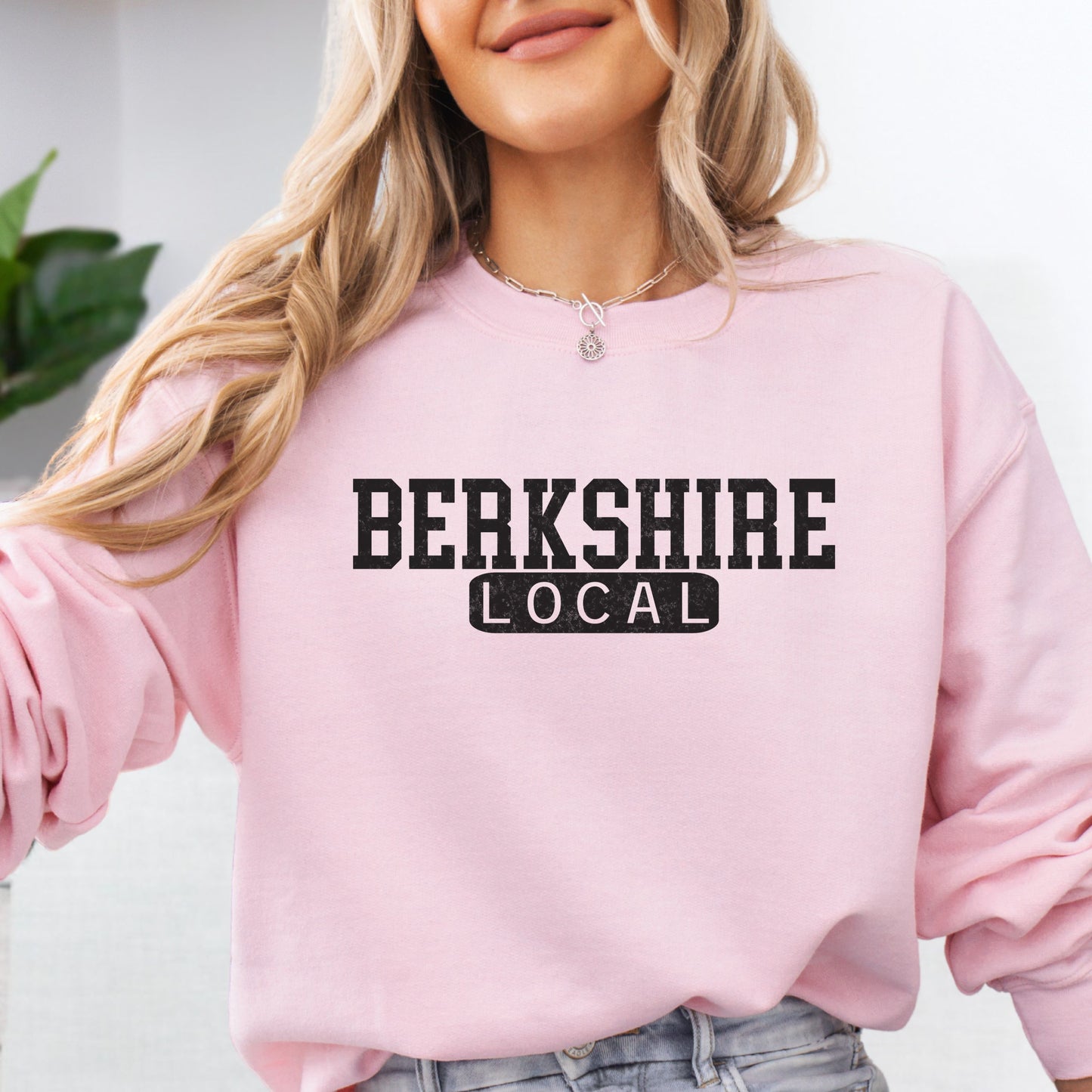 Person wearing Berkshire Local vintage distressed Massachusetts crewneck sweatshirt in the color light pink