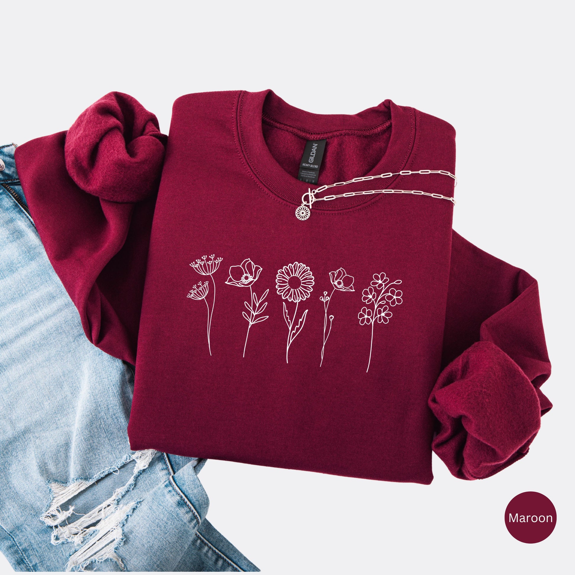 Wildflowers Crewneck Sweatshirt in the color maroon with white minimalist flowers