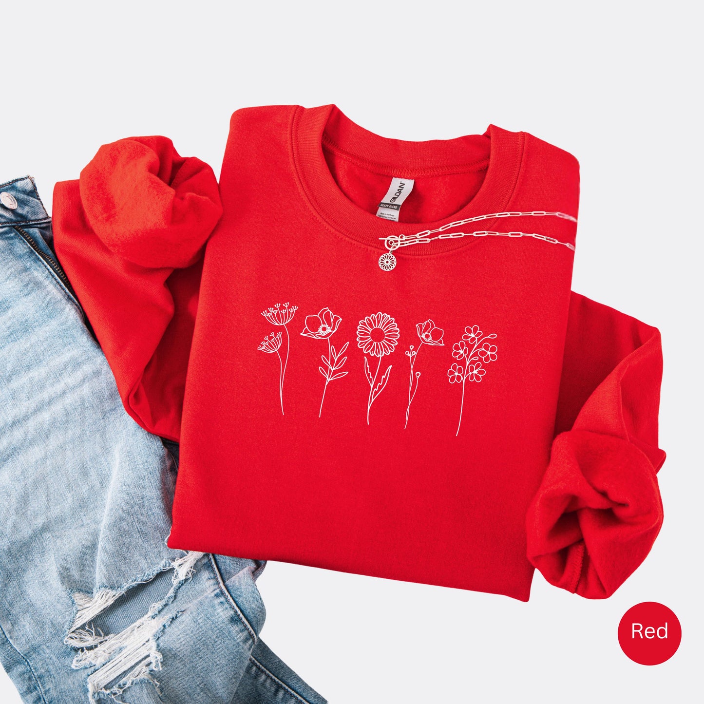 Wildflowers Crewneck Sweatshirt in the color red with white minimalist flowers