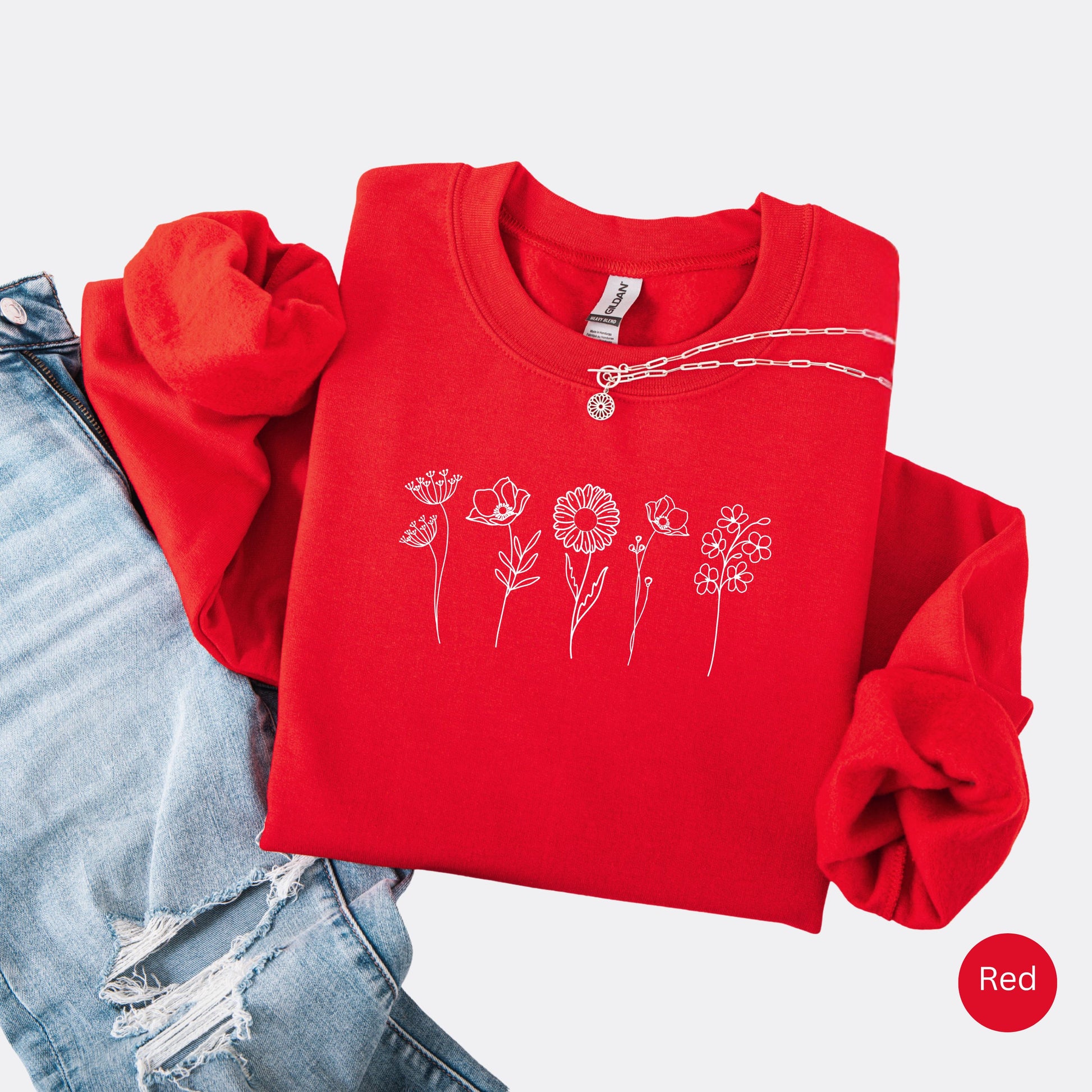 Wildflowers Crewneck Sweatshirt in the color red with white minimalist flowers