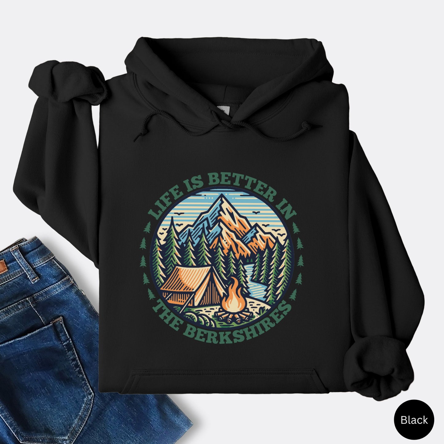 Black Hoodie with mountain scene, pine trees, tent, and campfire graphic with the text Life is Better in the Berkshires
