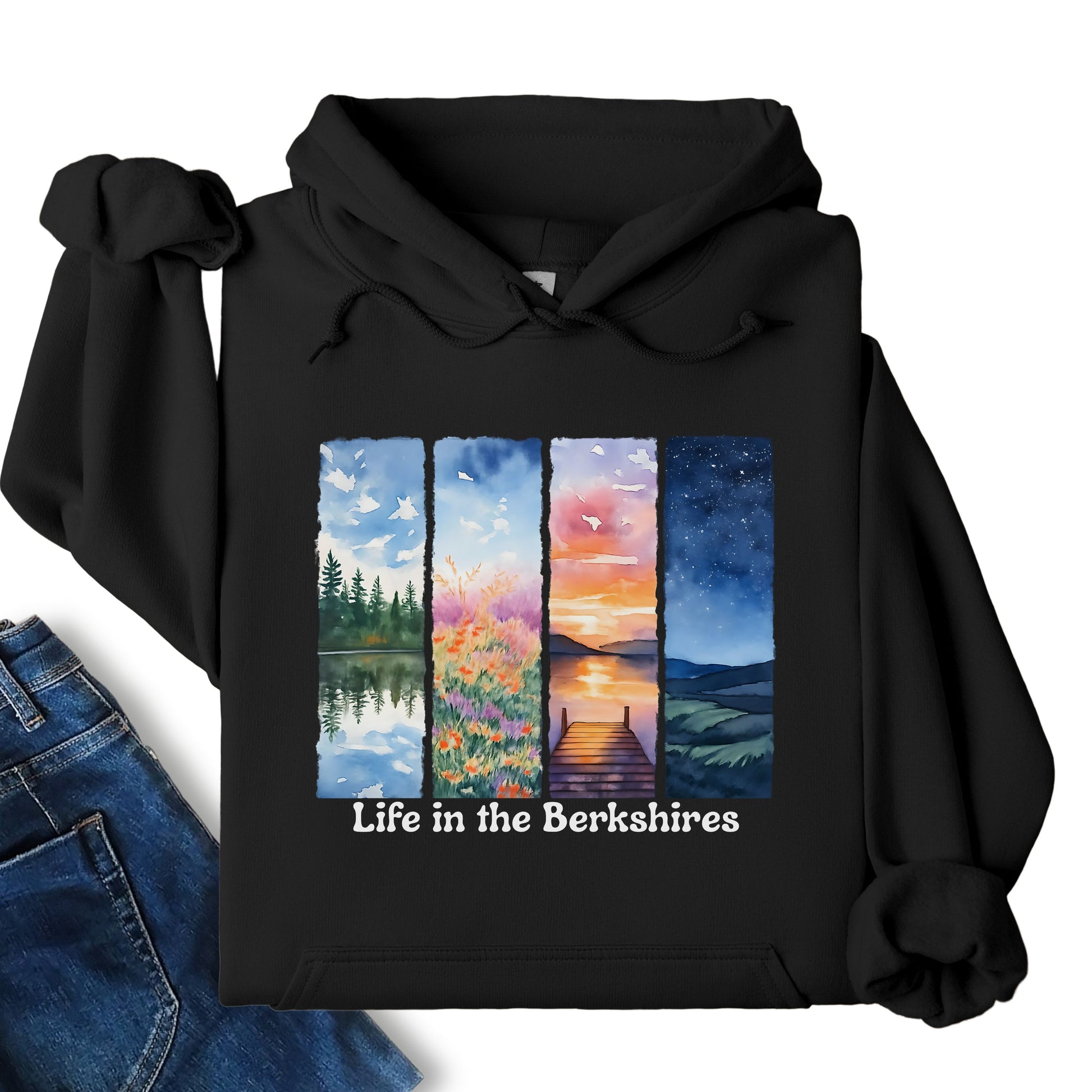 Life in the Berkshires hoodie laid flat showing scenic landscape panel graphic on the front in black