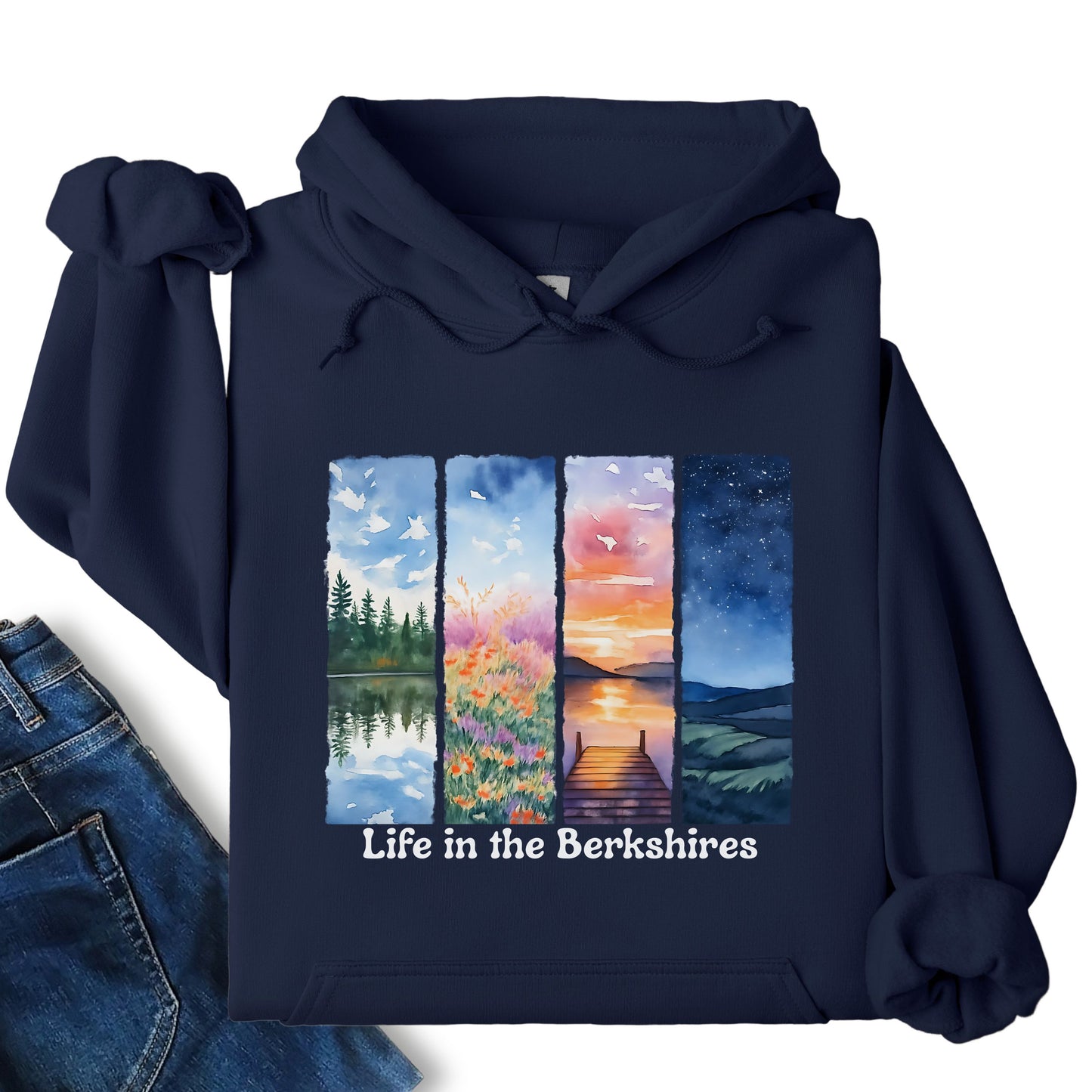 Life in the Berkshires hoodie laid flat showing scenic landscape panel graphic on the front in navy