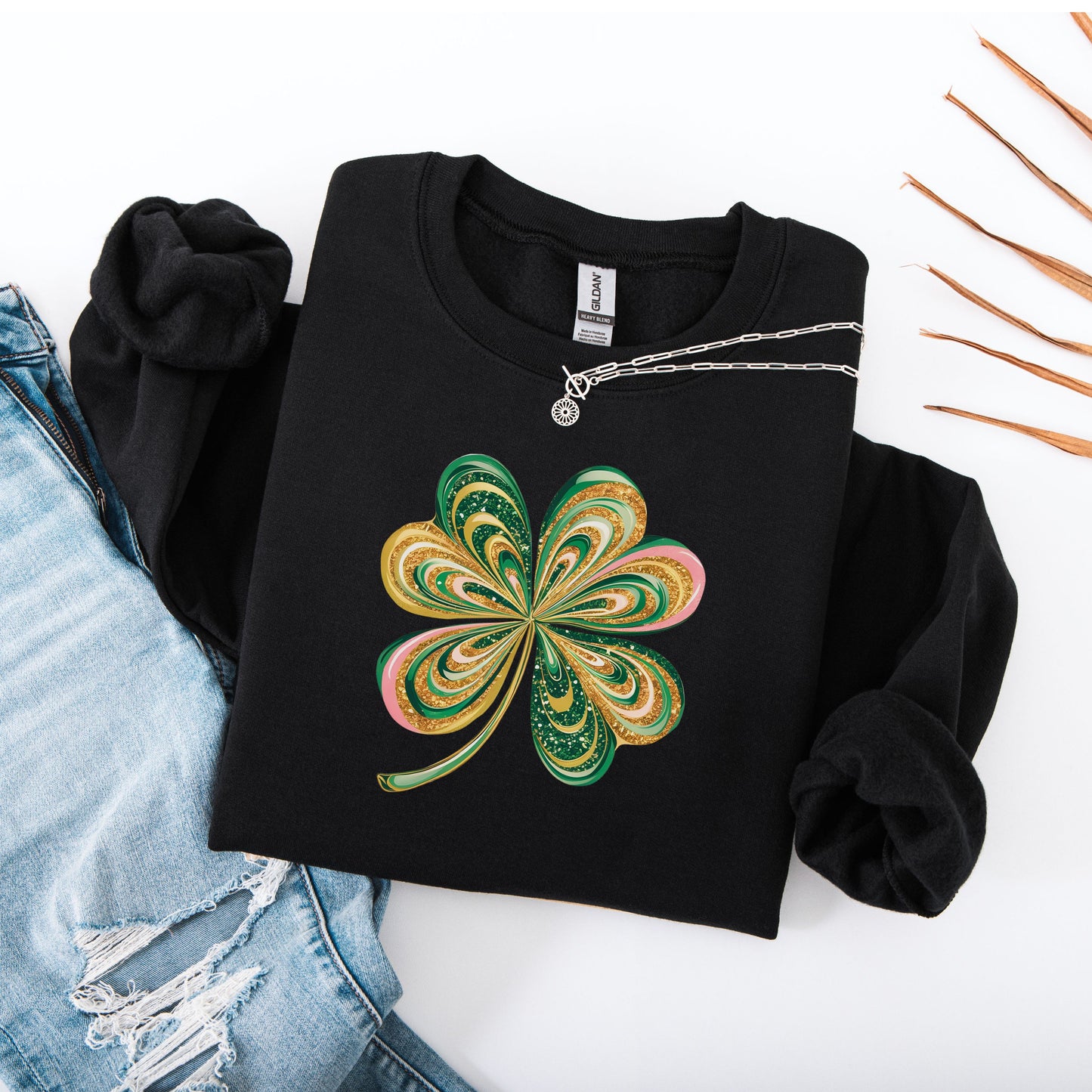 Retro shamrock design on Gildan black sweatshirt flat lay