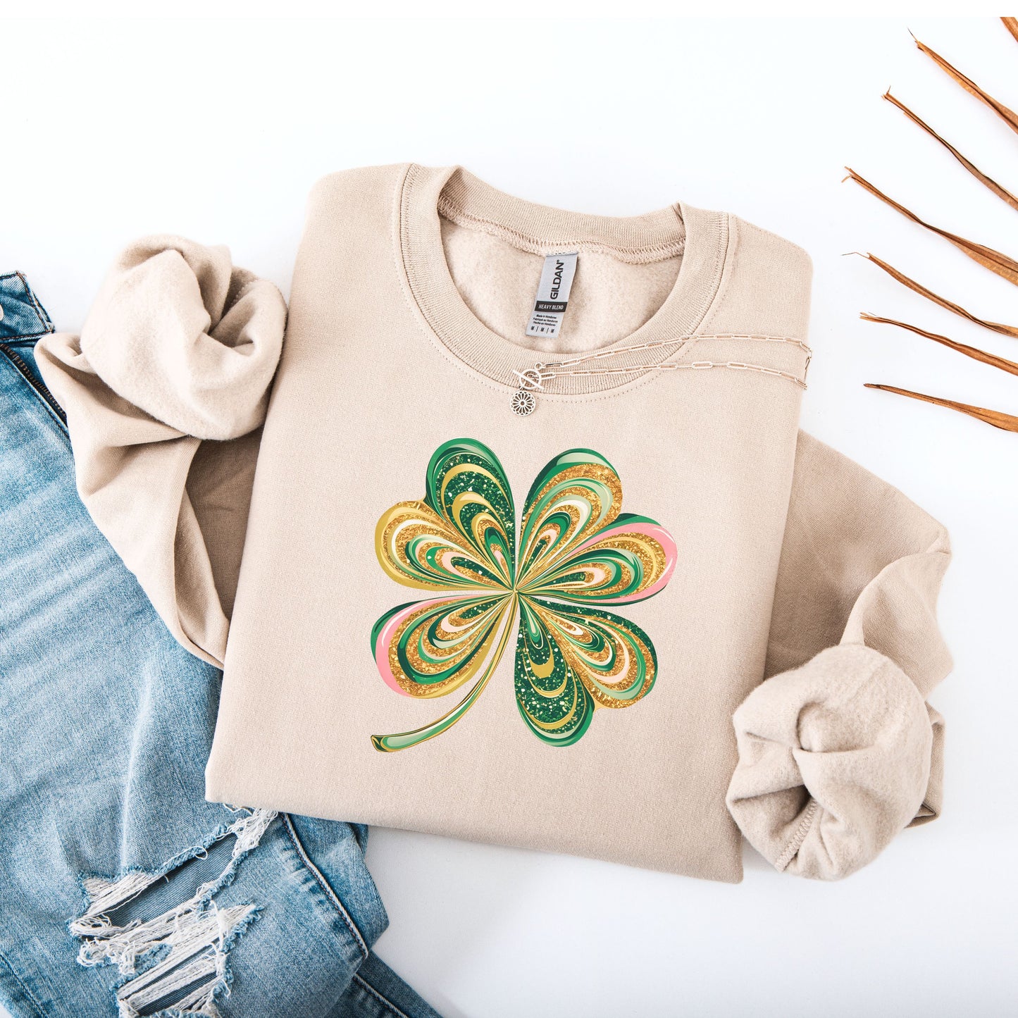 Retro shamrock design on Gildan sand sweatshirt flat lay