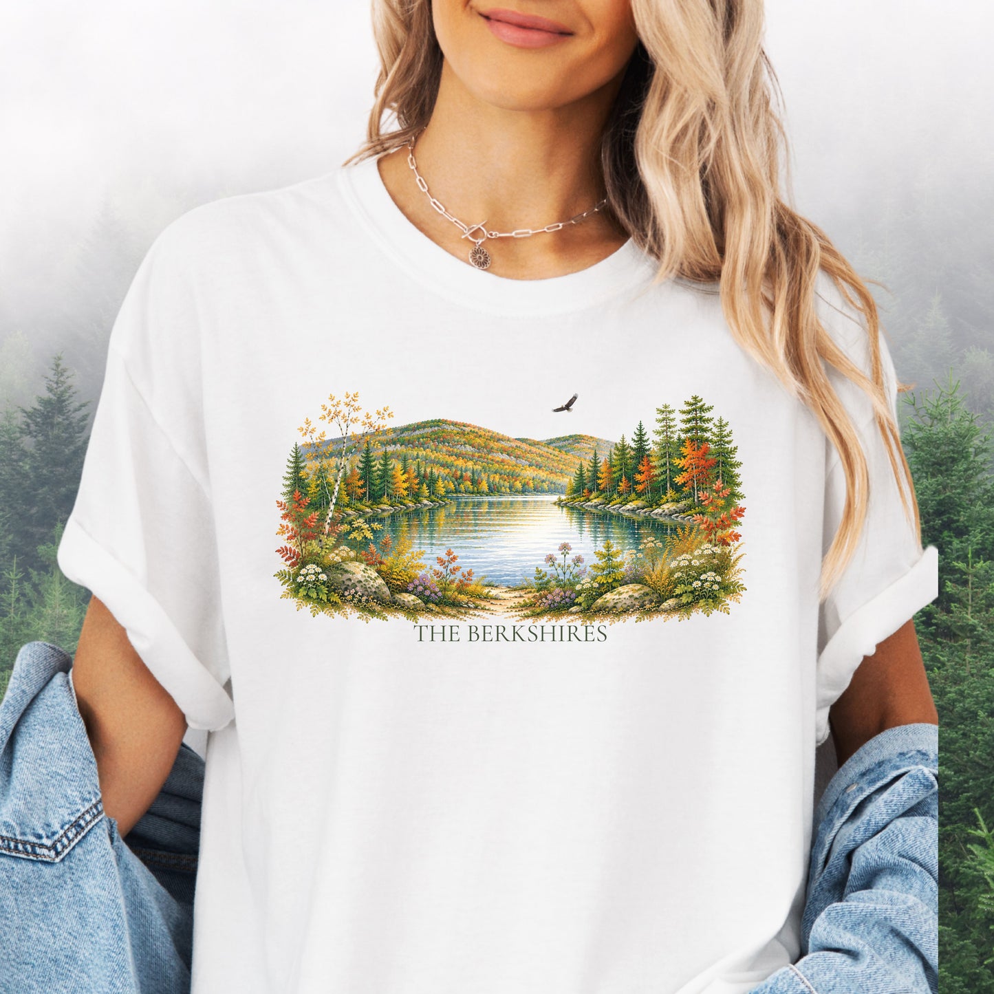 Person wearing The Berkshires autumn landscape Comfort Colors T-shirt with colorful fall foliage, mountains, lake and eagle in the color white.